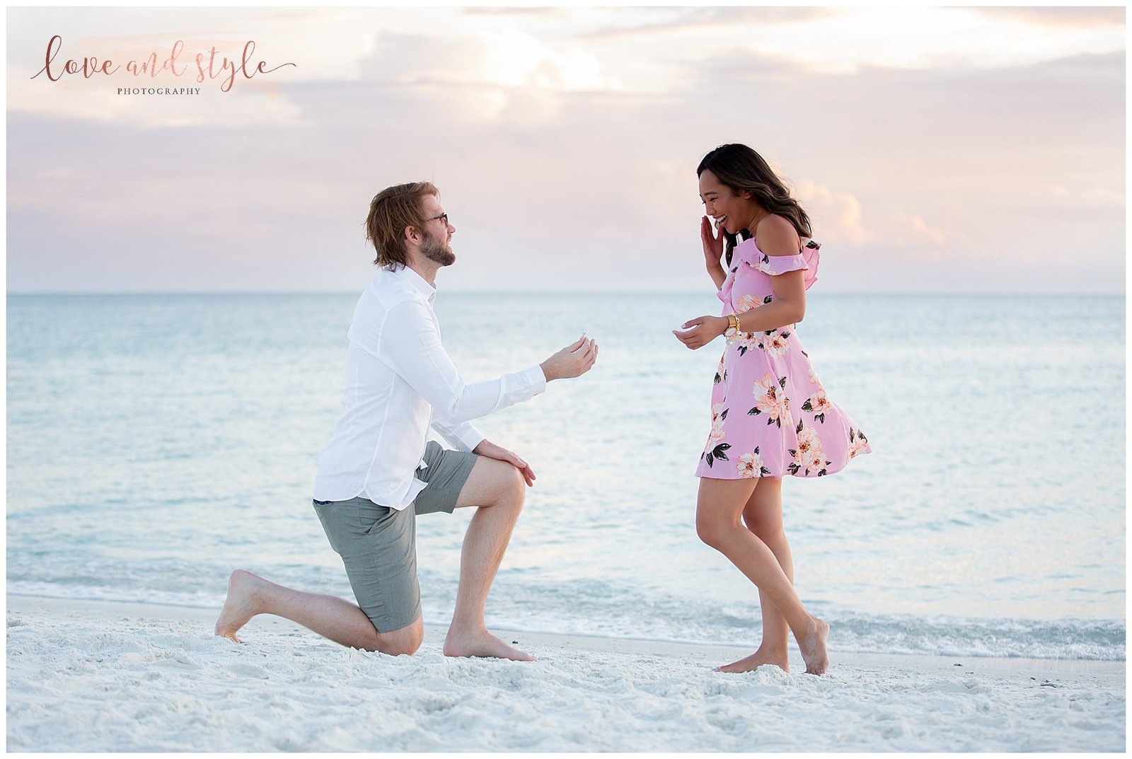 Young couple getting engaged on Anna Maria Island on the beach