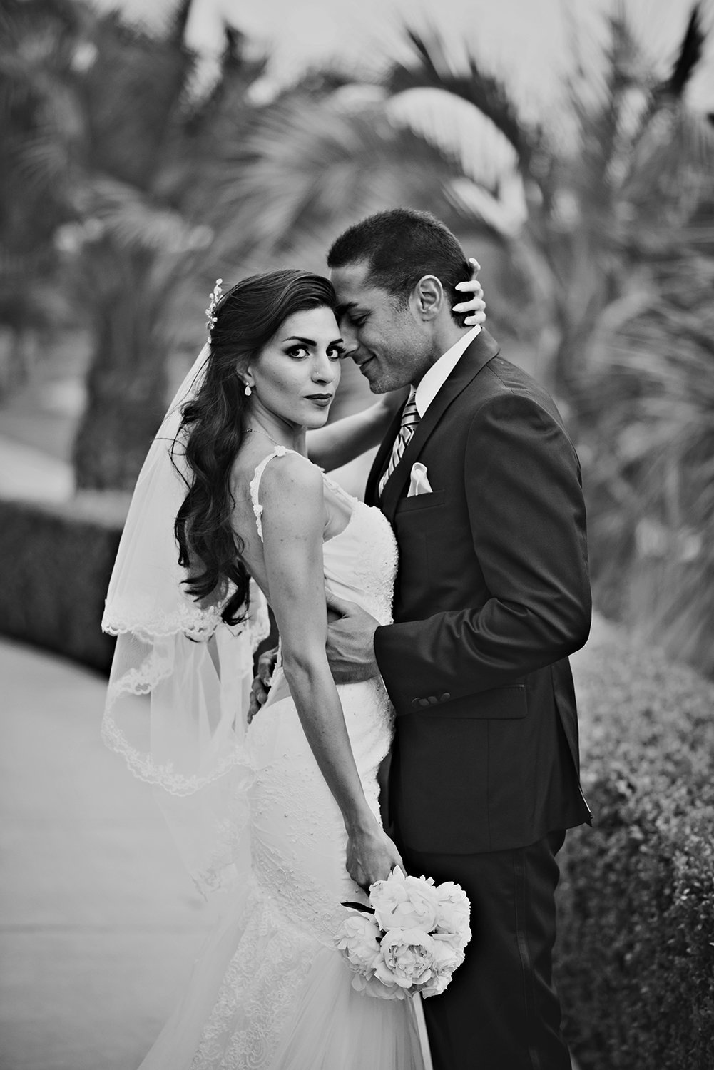 Striking black and white wedding portrait of a Persian Bride and Groom