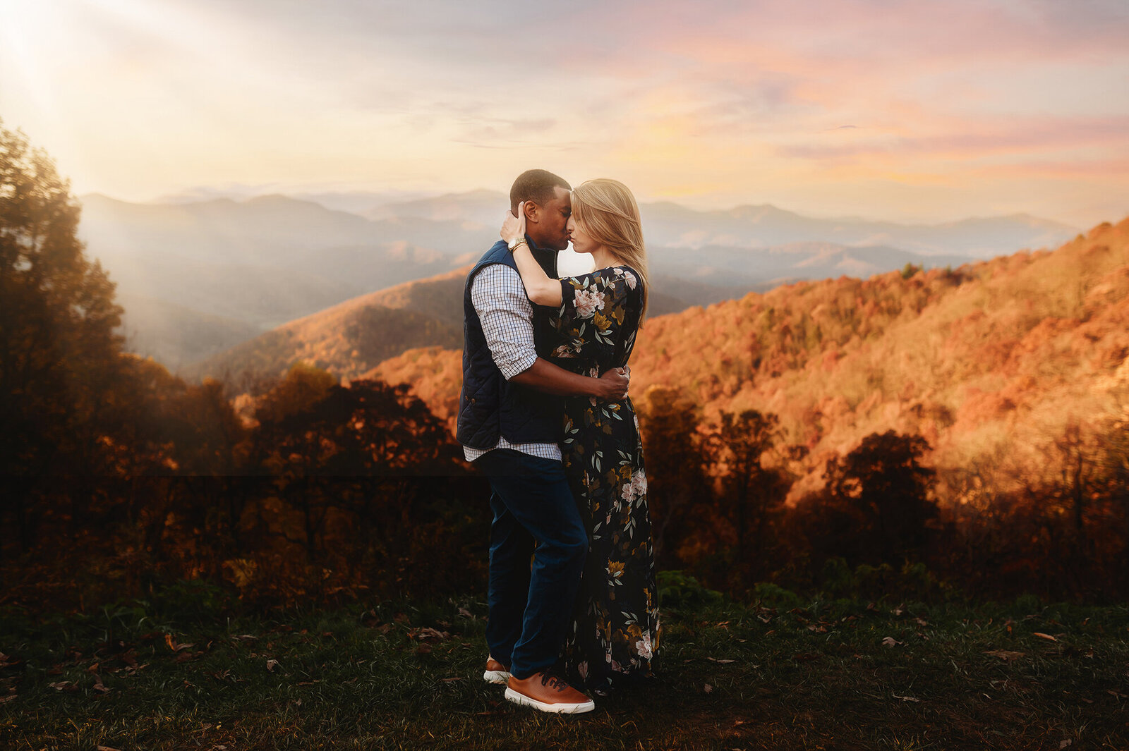 An engaged couple poses for Engagement Photos on the Blue Ridge Parkway in Asheville, NC.