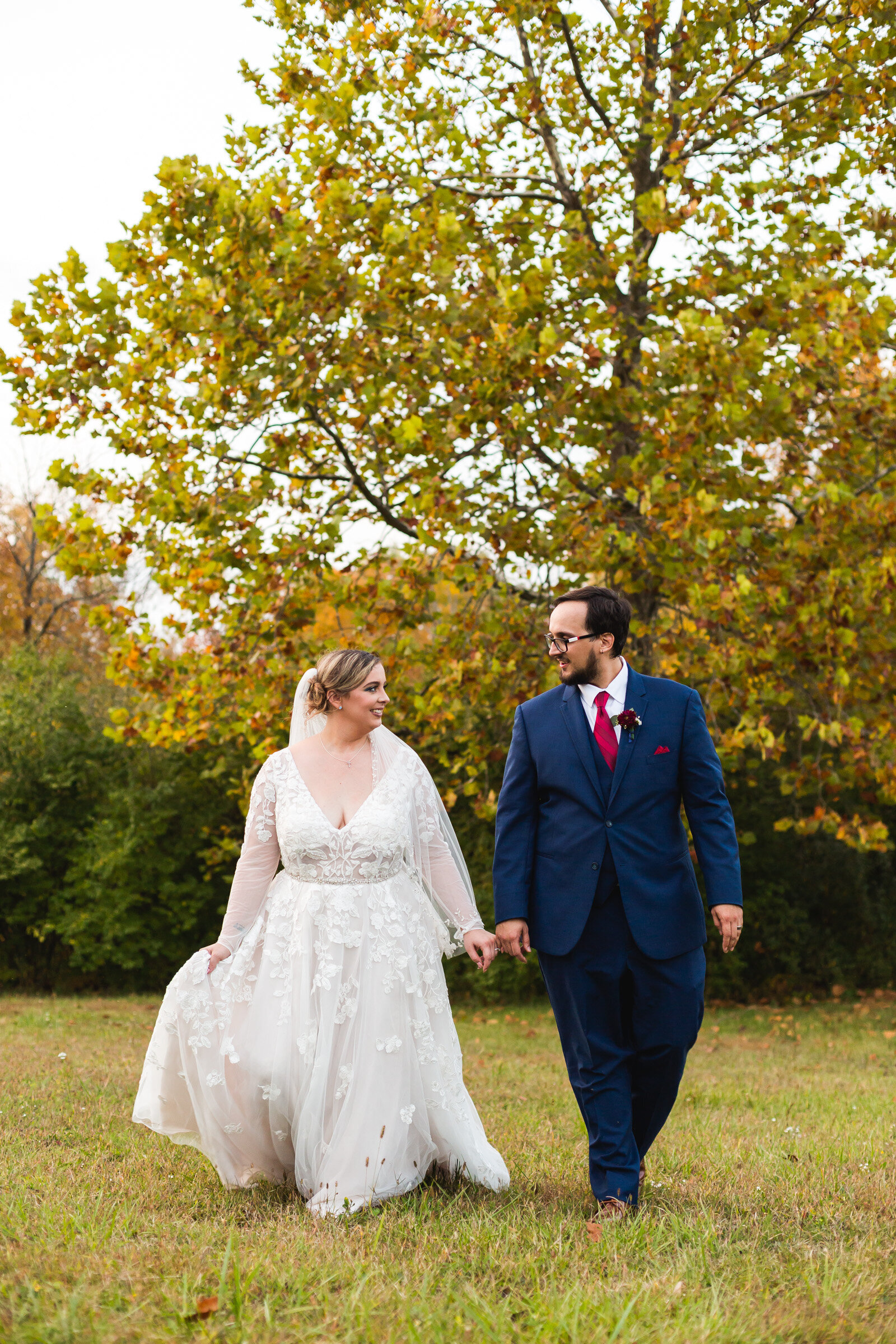 bride and groom walking at fall wedding in ohio