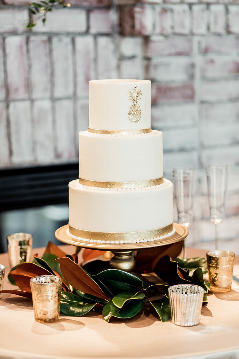 A gold and white cake is accented with a pineapple, Coleman Hall, Mt Pleasant, South Carolina