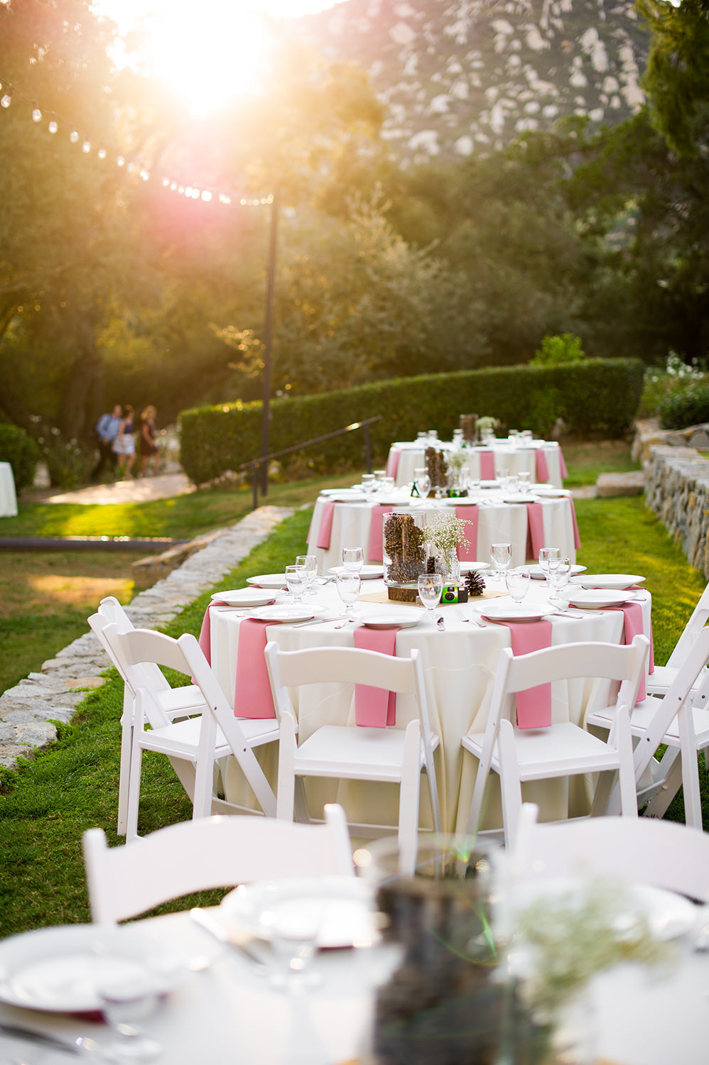 reception space with pink and white tables