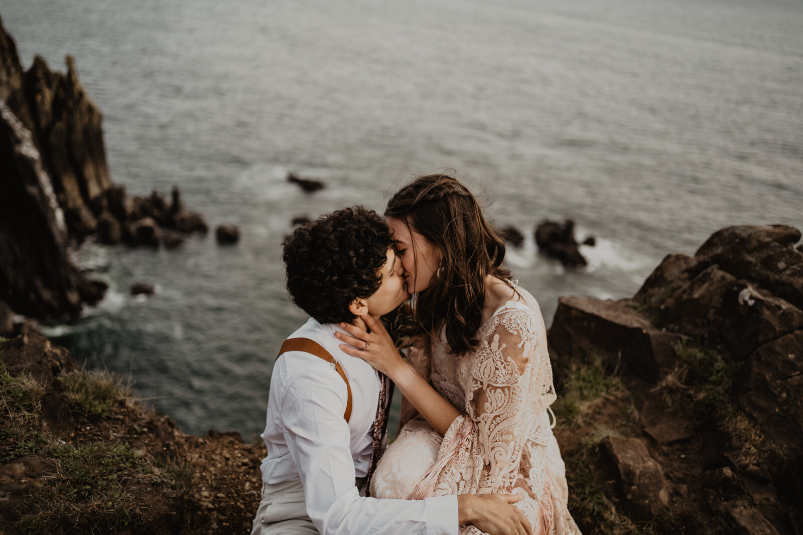 Elopement couple kissing on a cliff