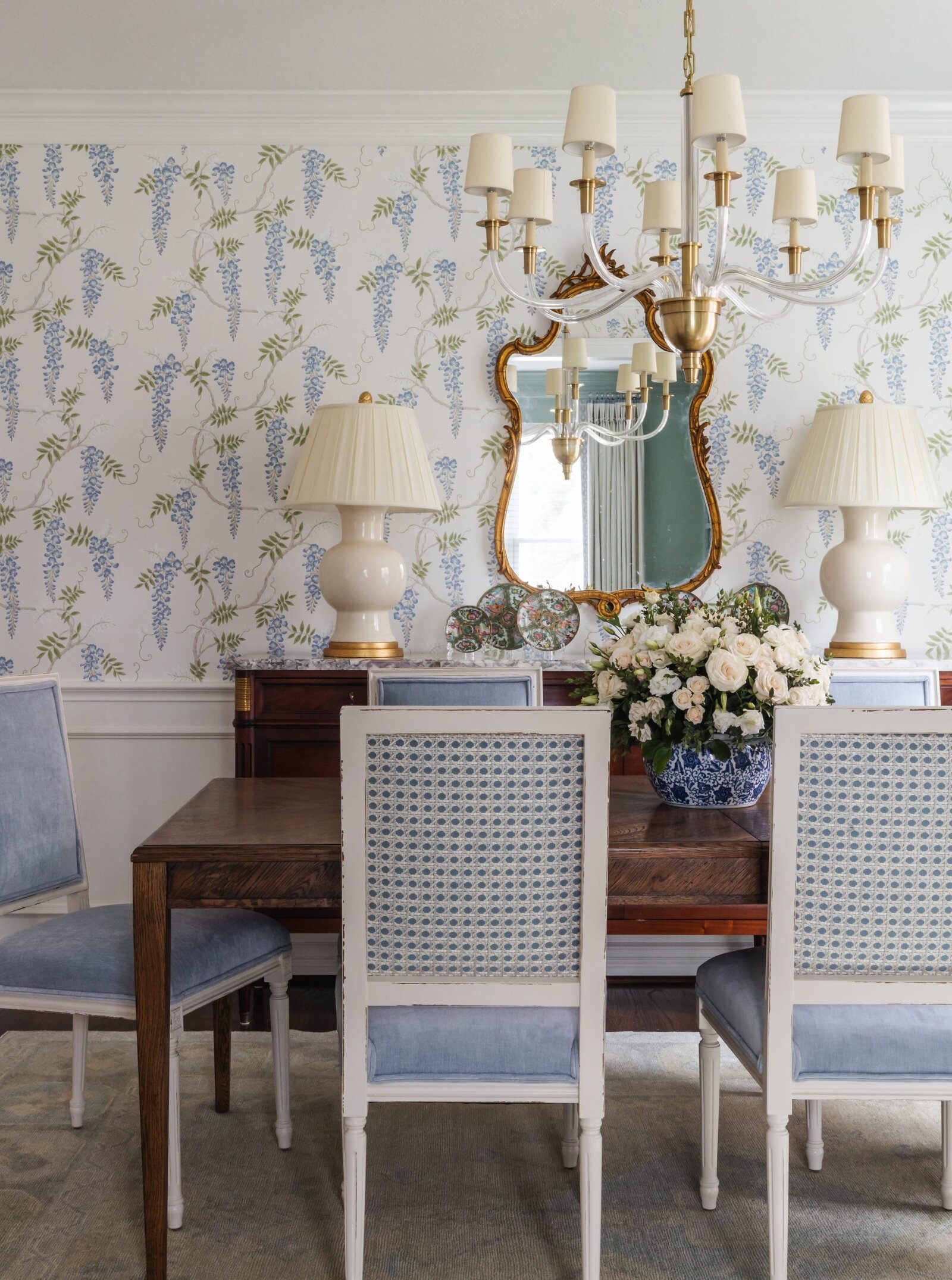 vision and hammer dining room with wallpaper and blue chairs