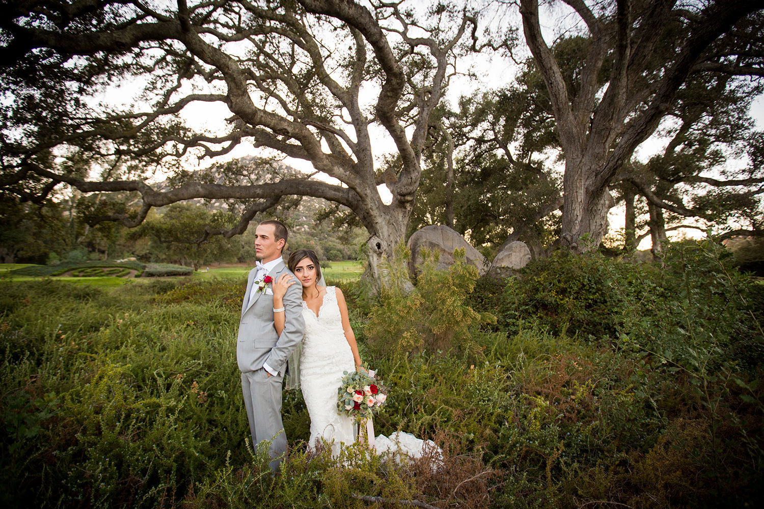 bride and groom on open field