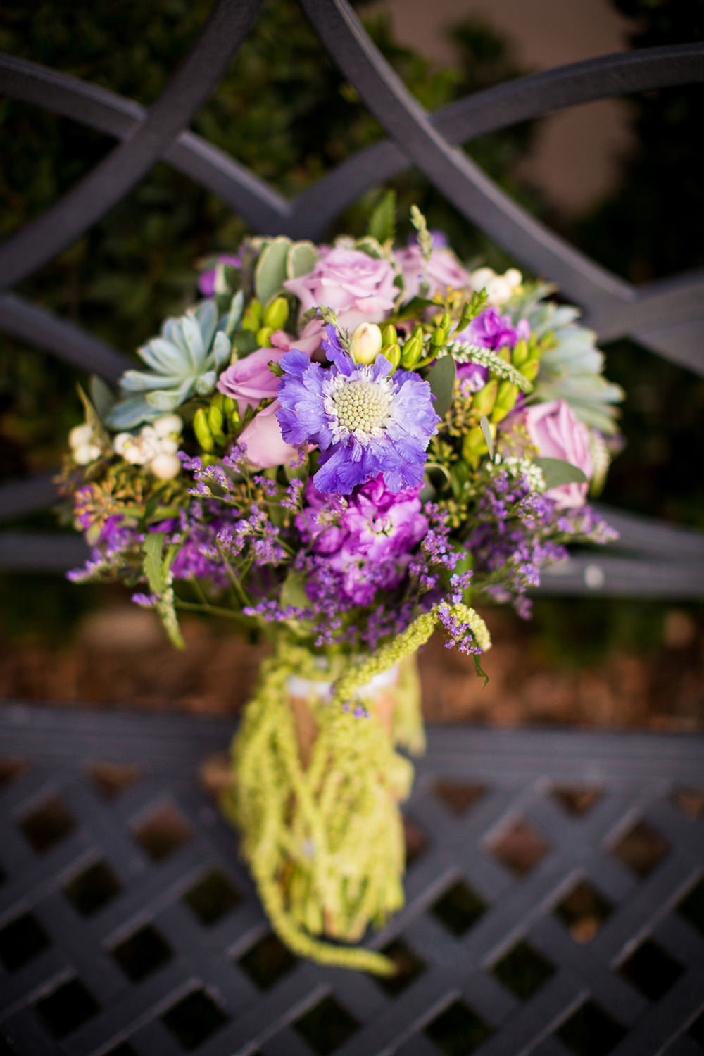 stunning bridal bouquet with purple blue and green flowers