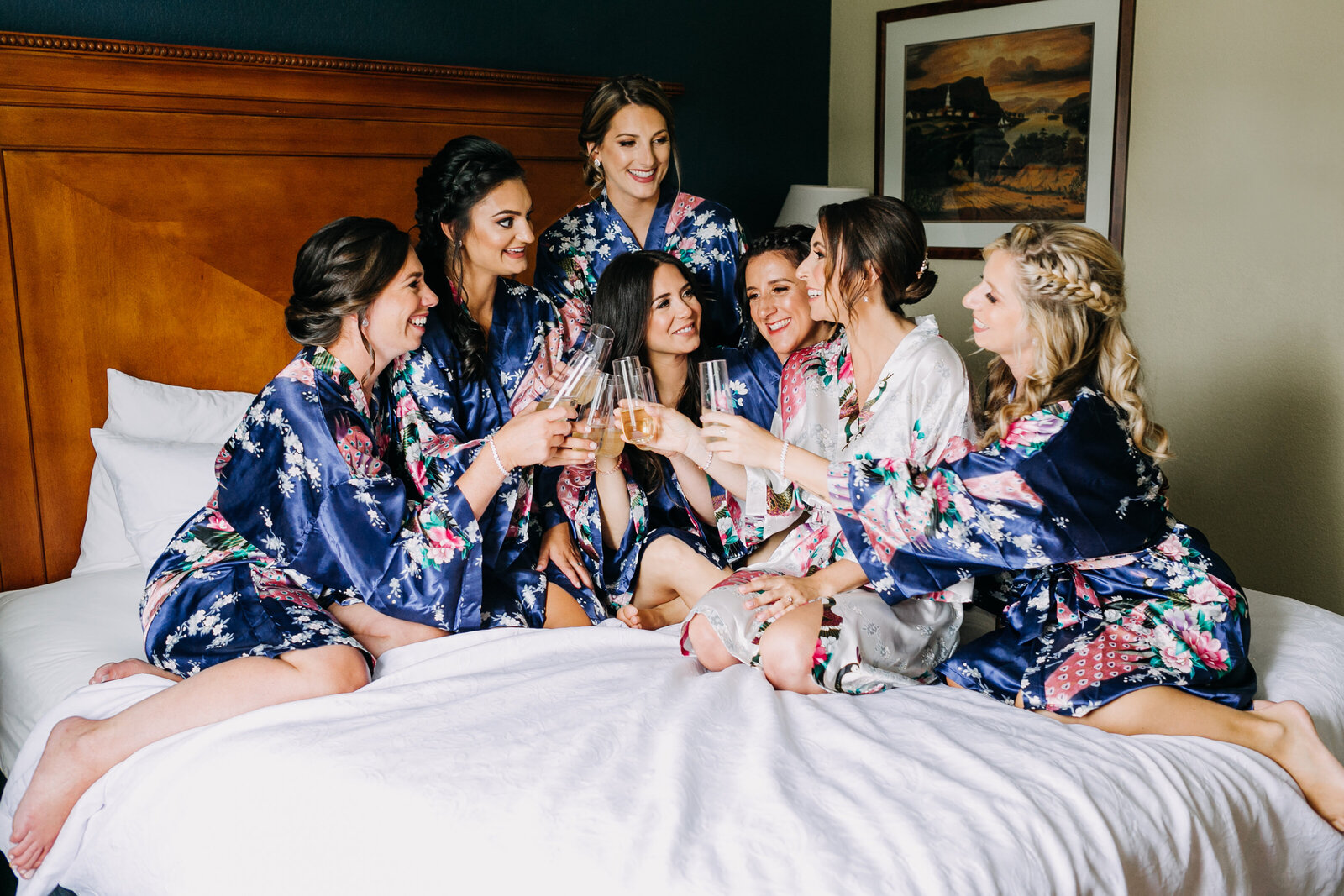bride and bridesmaids cheering with champagne
