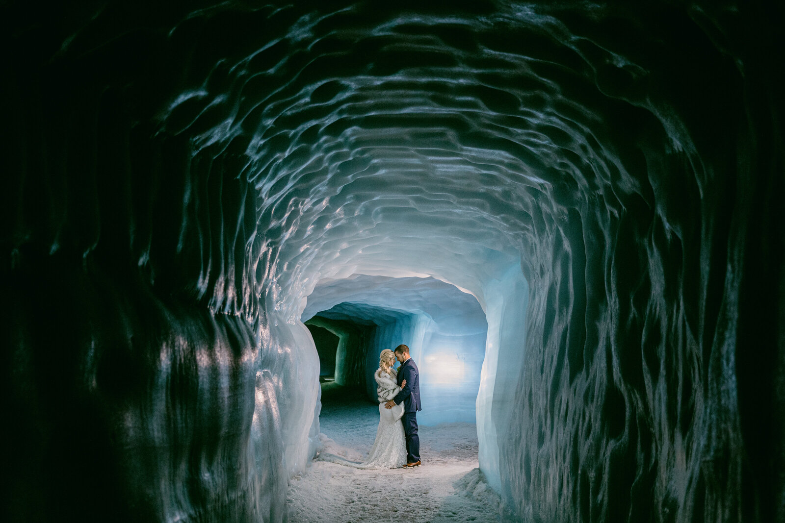 bride and groom in ice cave in iceland