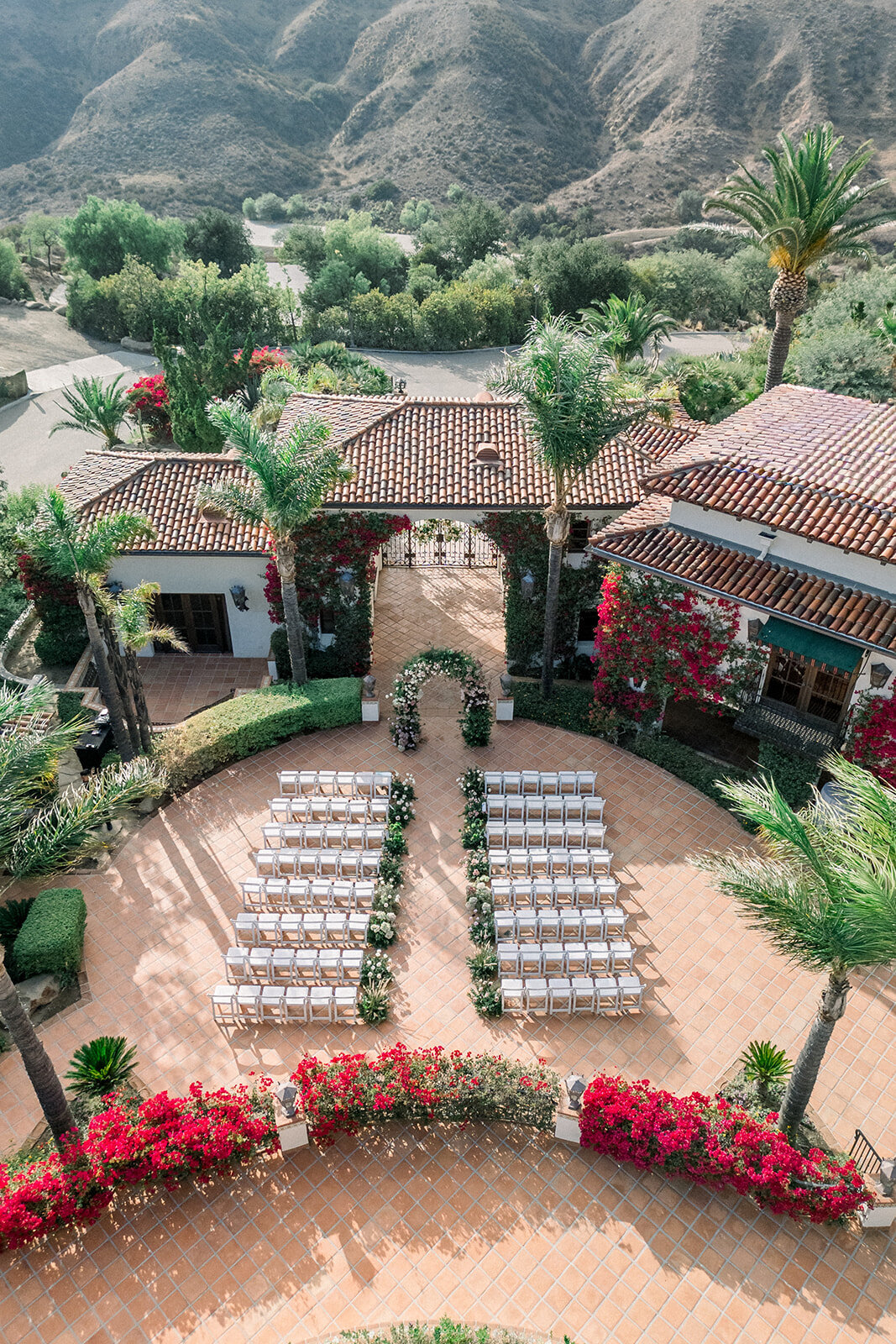 Overhead image of terraced ceremony site surrounded by greenery at Hummingbird Nest Ranch, captured by editorial wedding photographer.