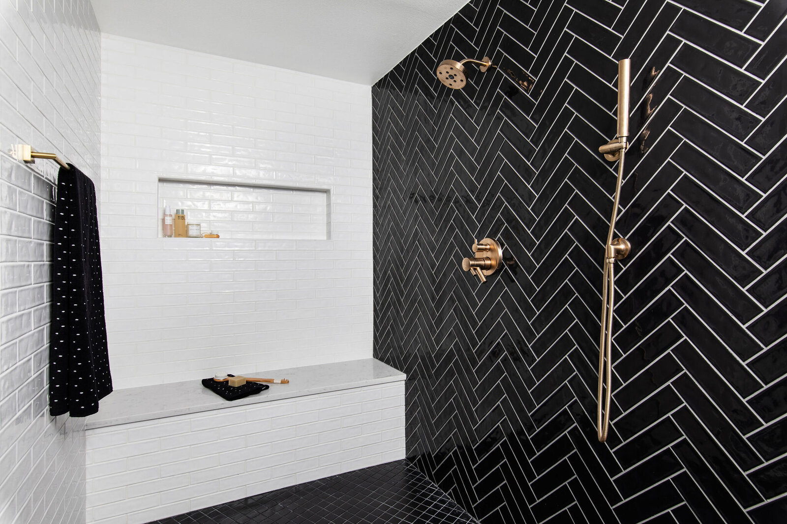 black+herringbone+tile+shower+white+subway+tile+design+nuela+interior+design