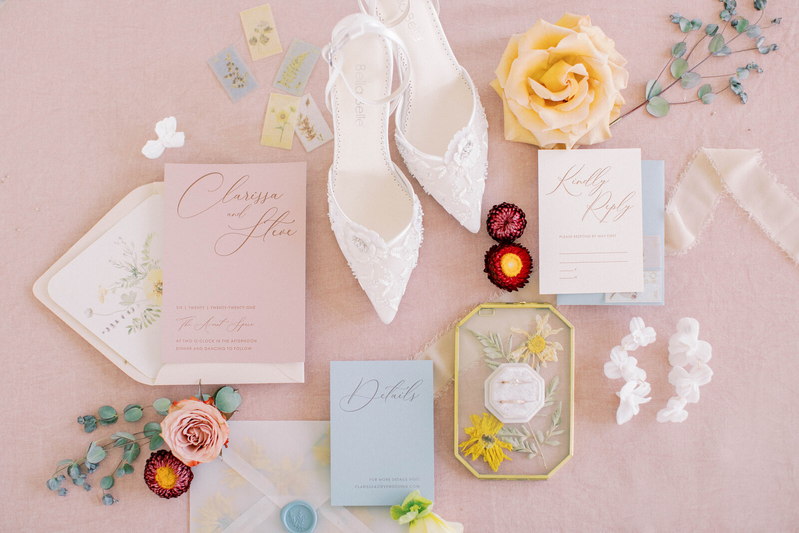 A-Vent Event Space soft pink and blue wedding detail flat lay
