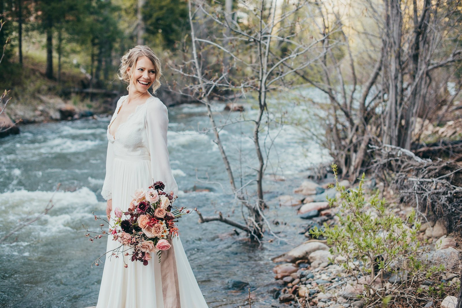 A bride by the Pecos River at Brush Creek Ranch in New Mexico