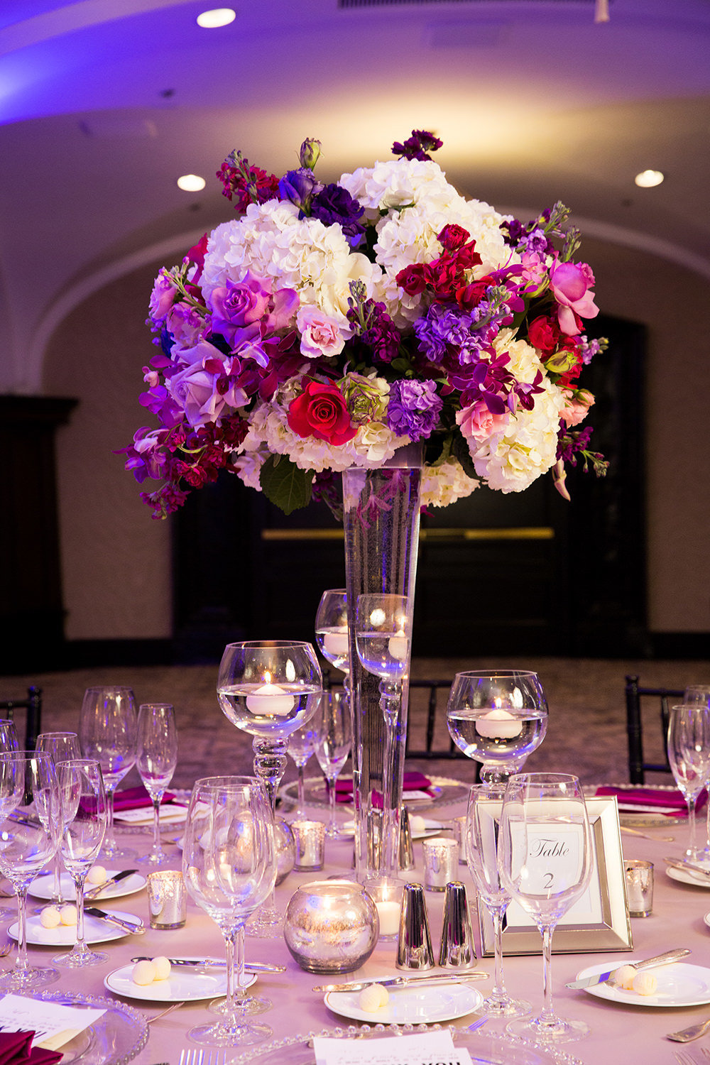 table arrangement with purples and pink flowers us grant hotel