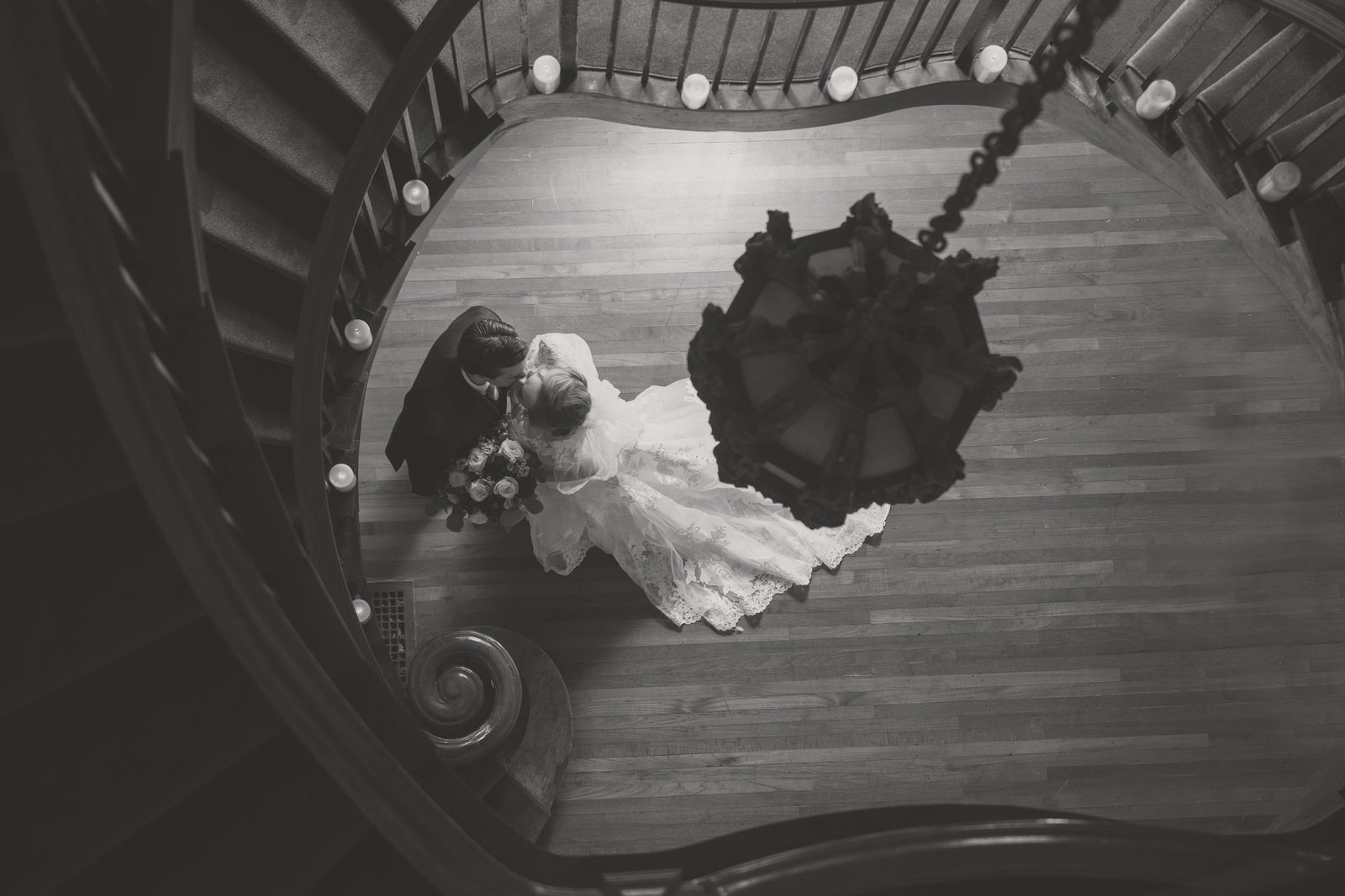 bride and groom black and white photo from top of stairs at Coindre Hall wedding