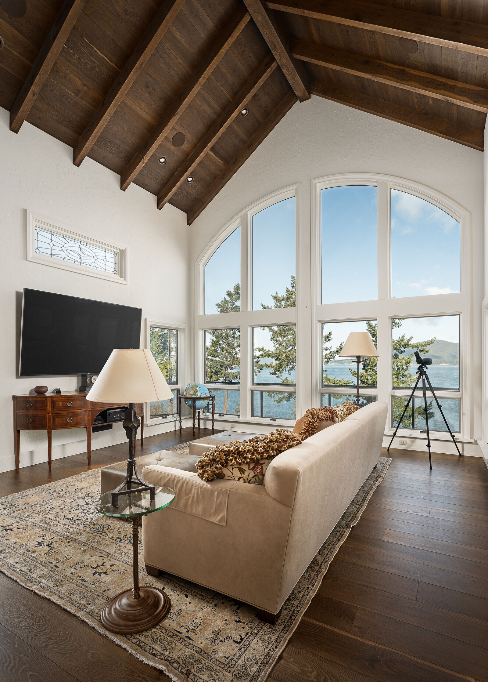 vaulted living room with ocean view