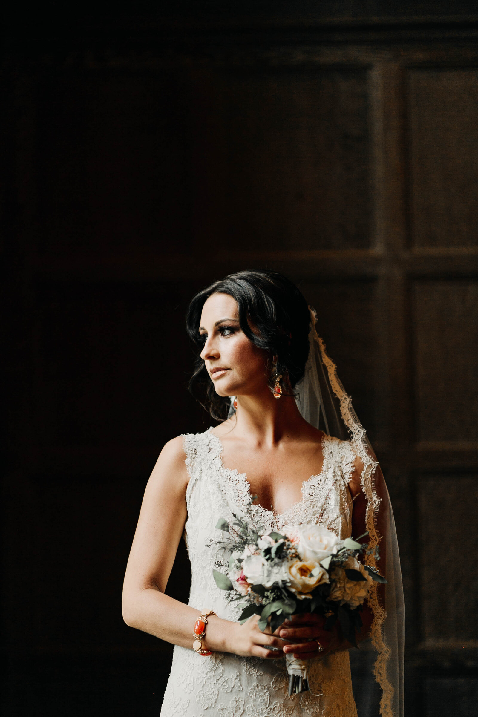 bride with lace dress at window light
