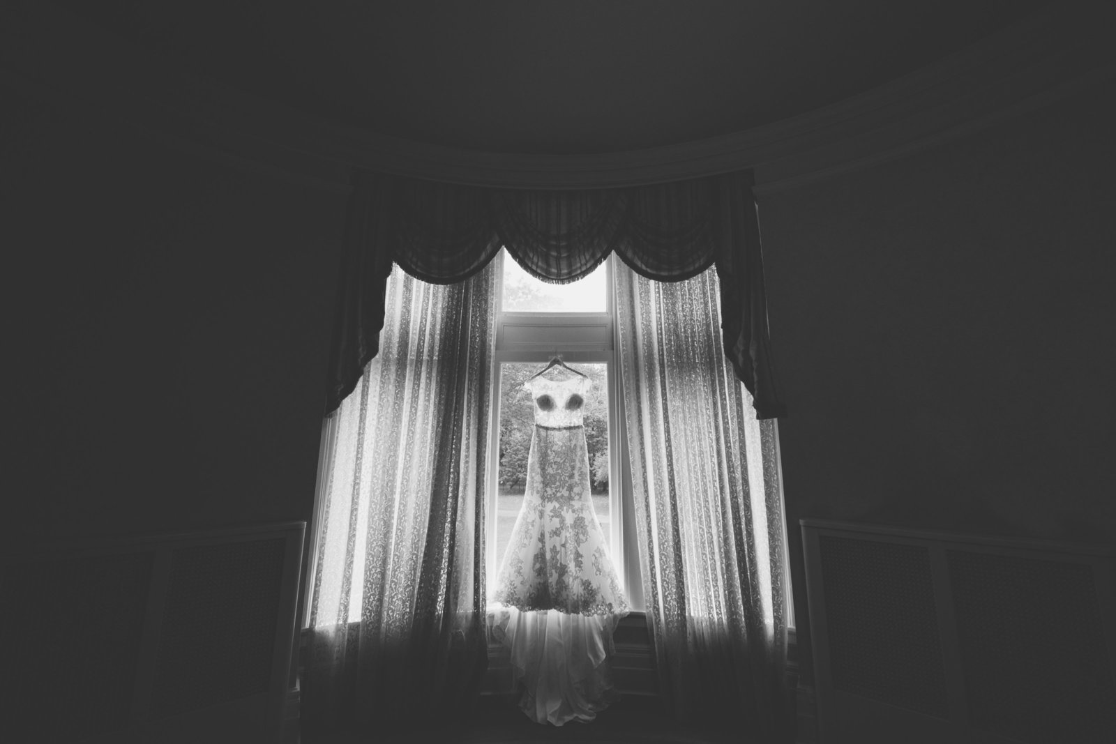 black and white creative photo of dress at Coindre Hall wedding