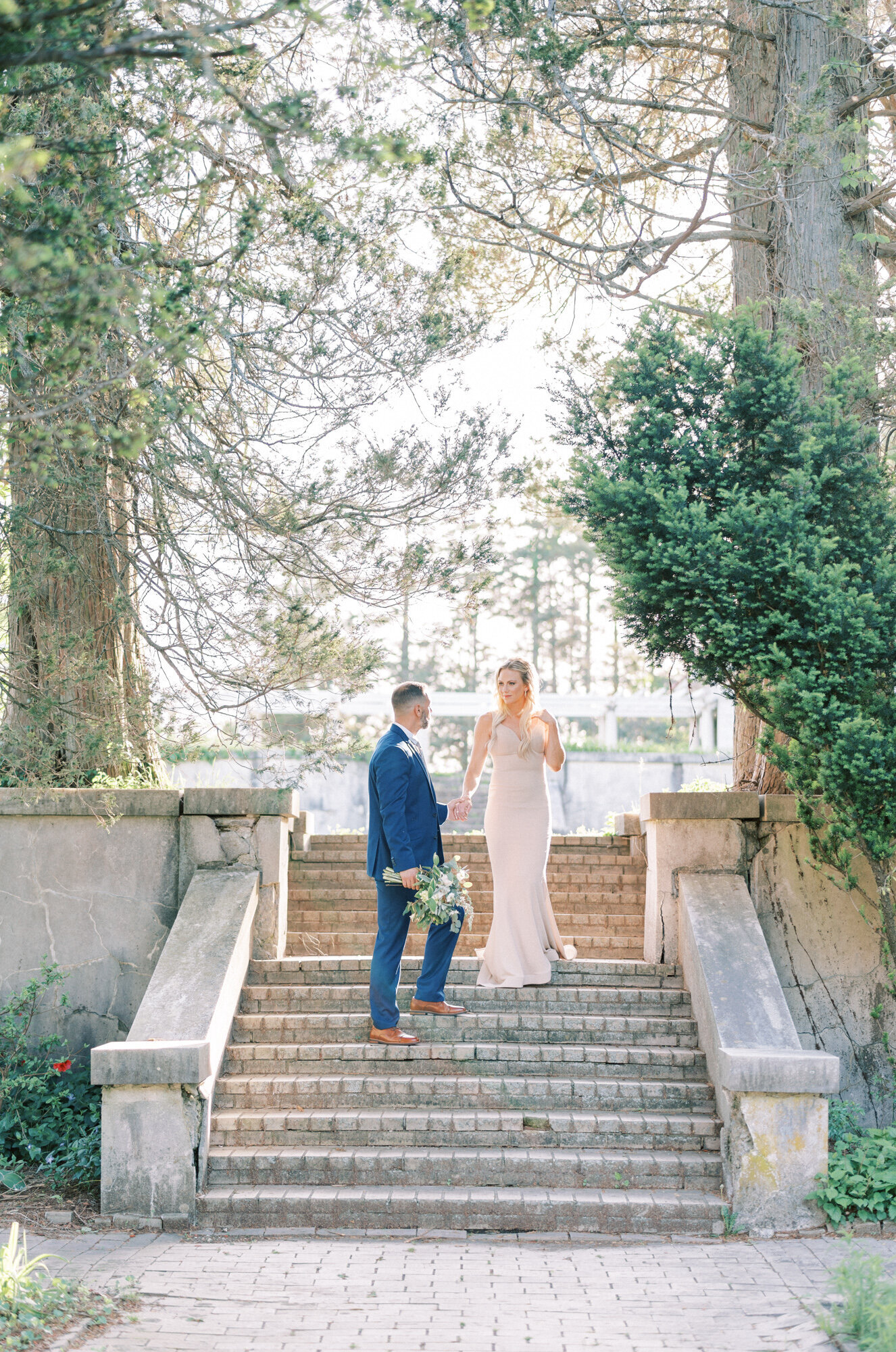 Groom leads bride down romantic steps in DC