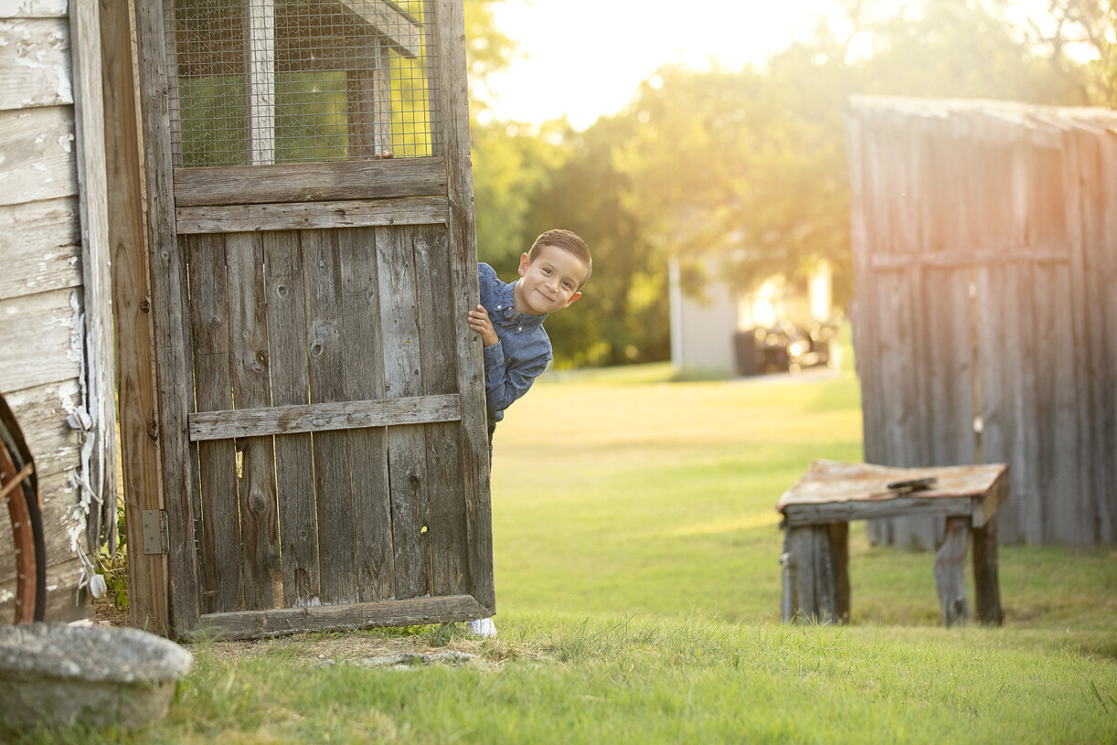 Photoshoot of boys playing at a farm in Mckinney, Texas