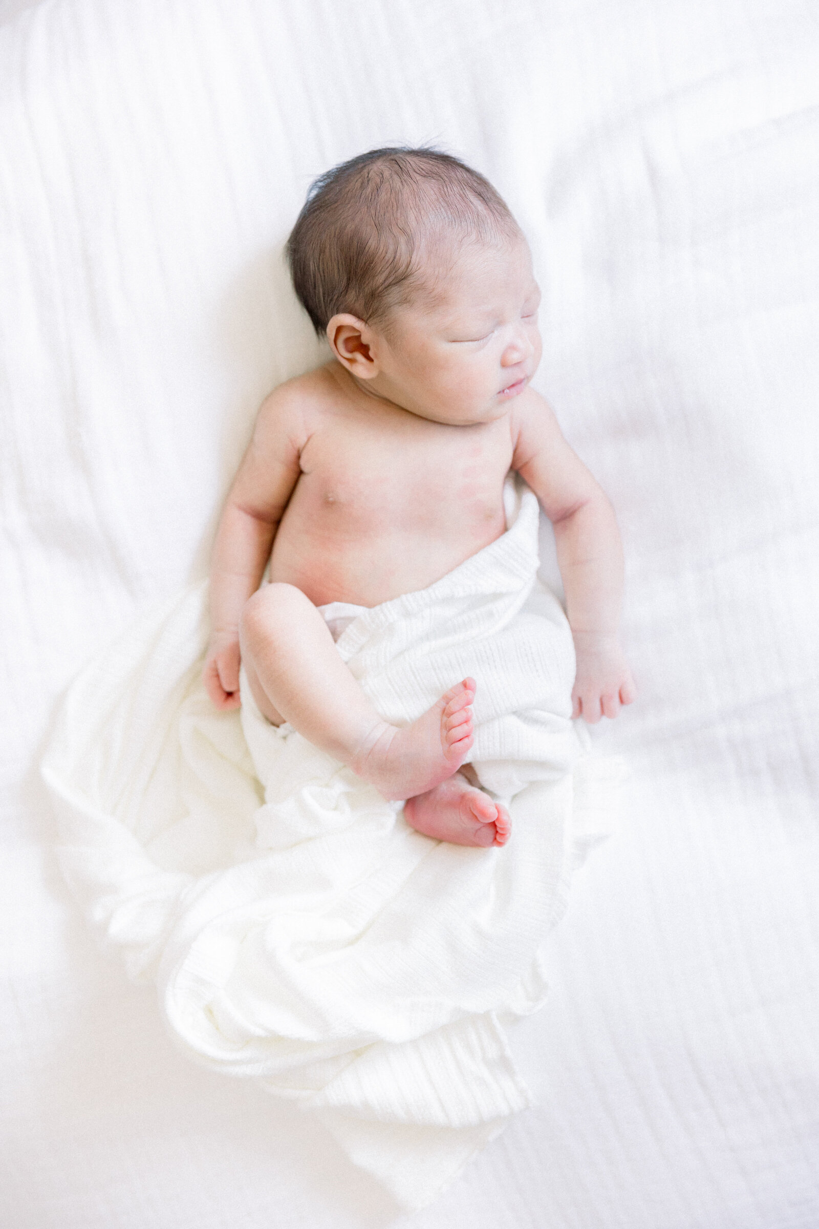 Image of sleeping baby full body taken by Sacramento Newborn Photographer Kelsey Krall