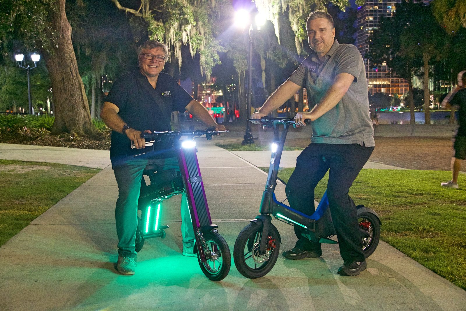 Two guys enjoying the nightlife on there Purple Go-Bike M2 & Blue Go-Bike M3