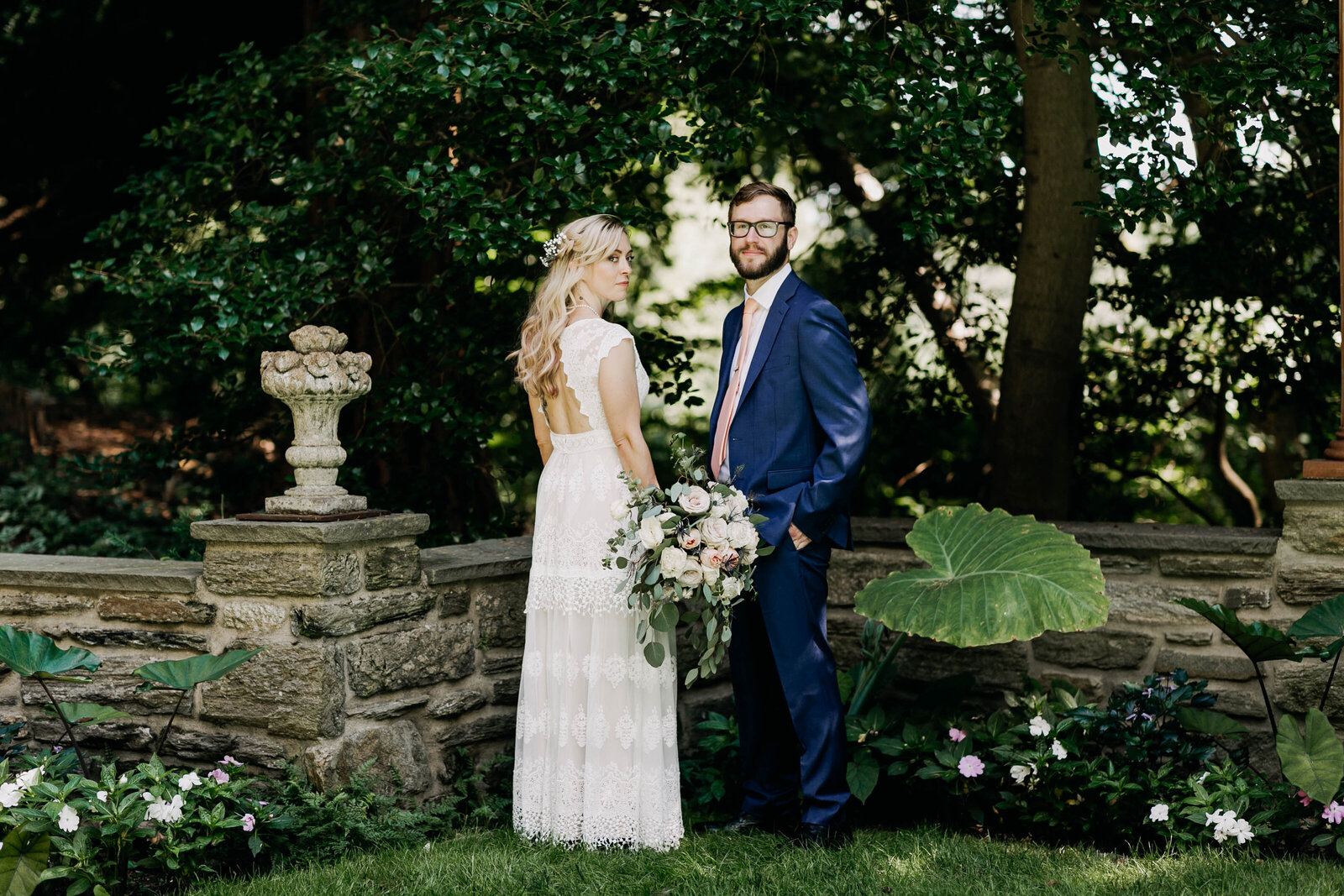 bride and groom in floral garden