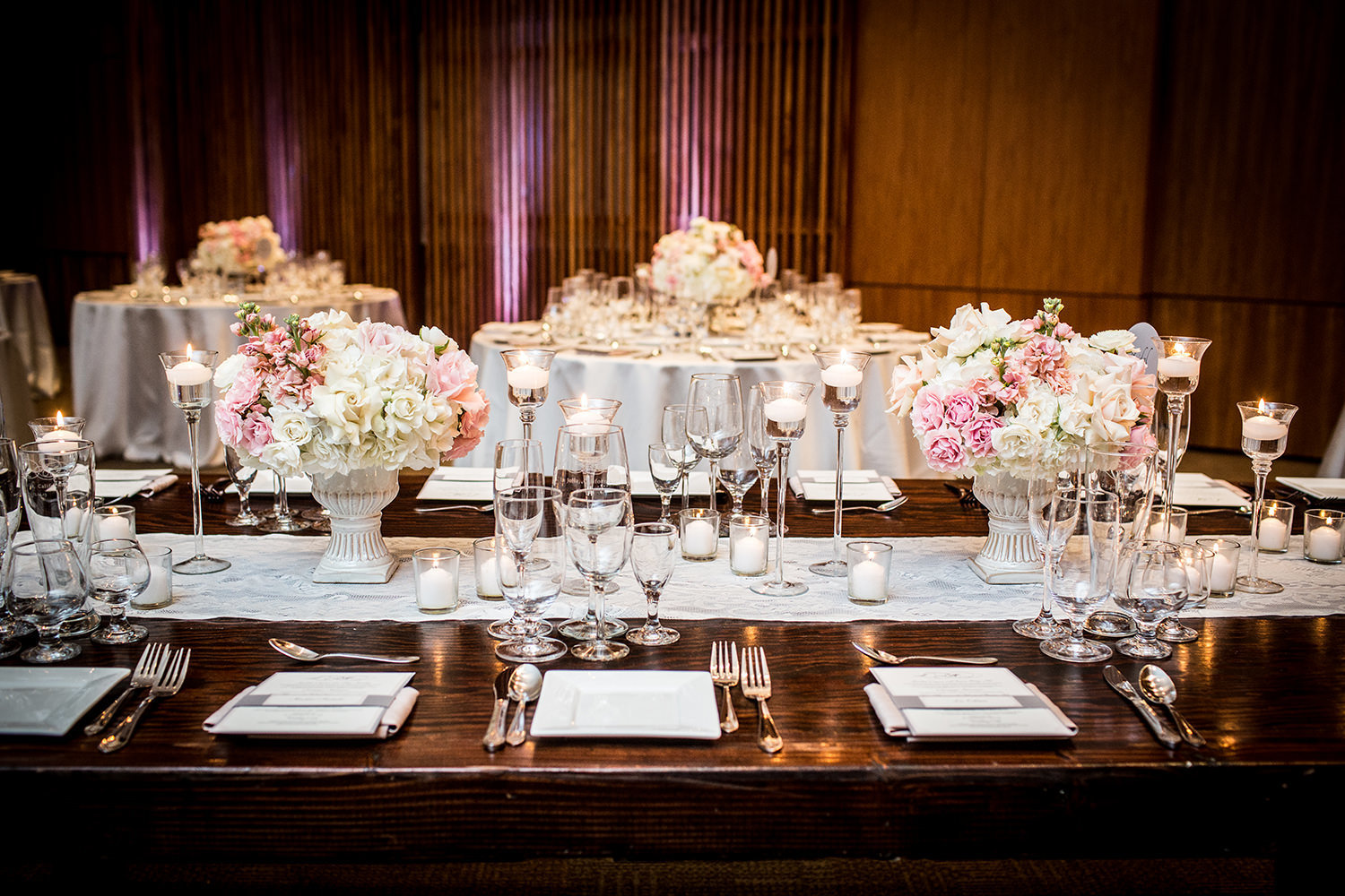 tables with pink and blush flowers
