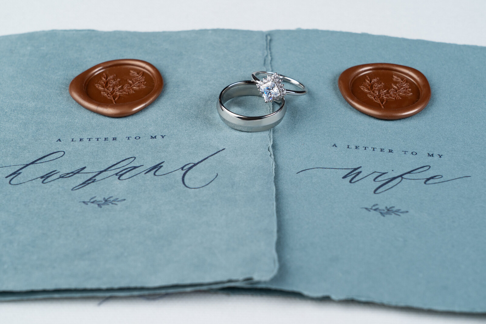 his and her vows along with a custom and unique square cut halo