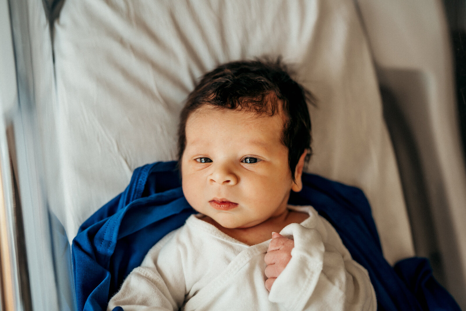 newborn in hosital bassinett