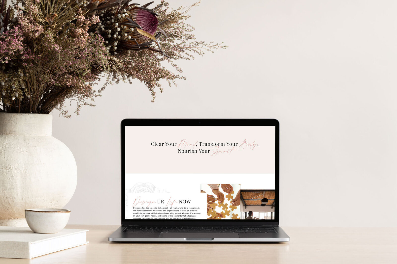 Featuring a sophisticated web design by The Agency, this laptop screen showcases the transformational journey offered by wellness experts in a clean, user-friendly interface.