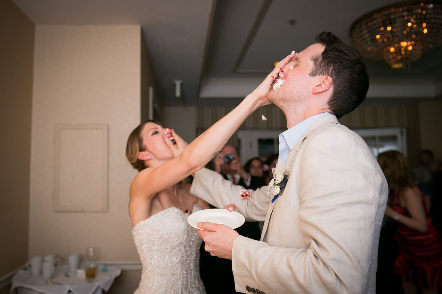 Cake smash at the wedding reception | L'Auberge Del Mar