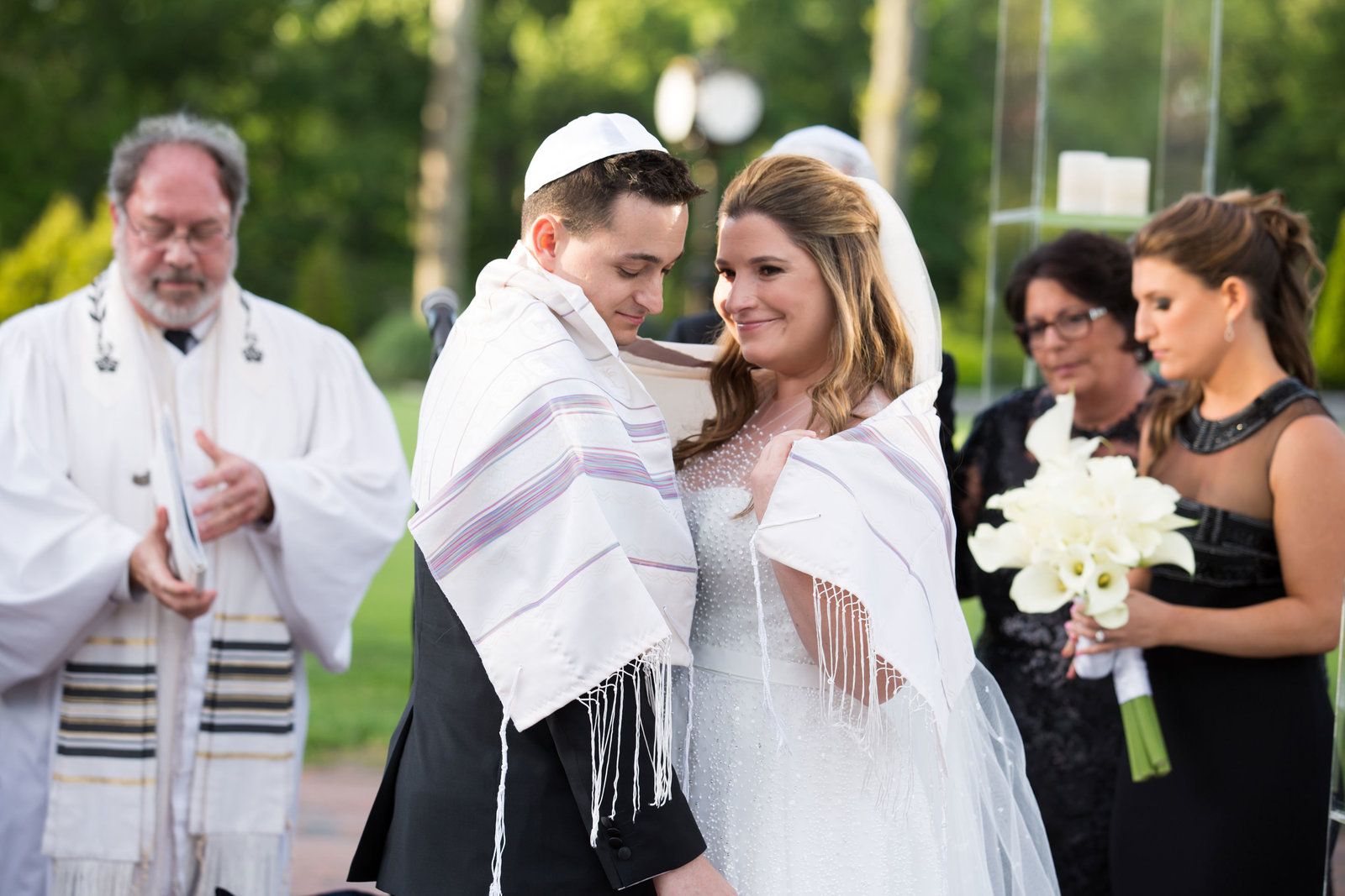 bride and groom during Jewish ceremony at Engineers Country Club