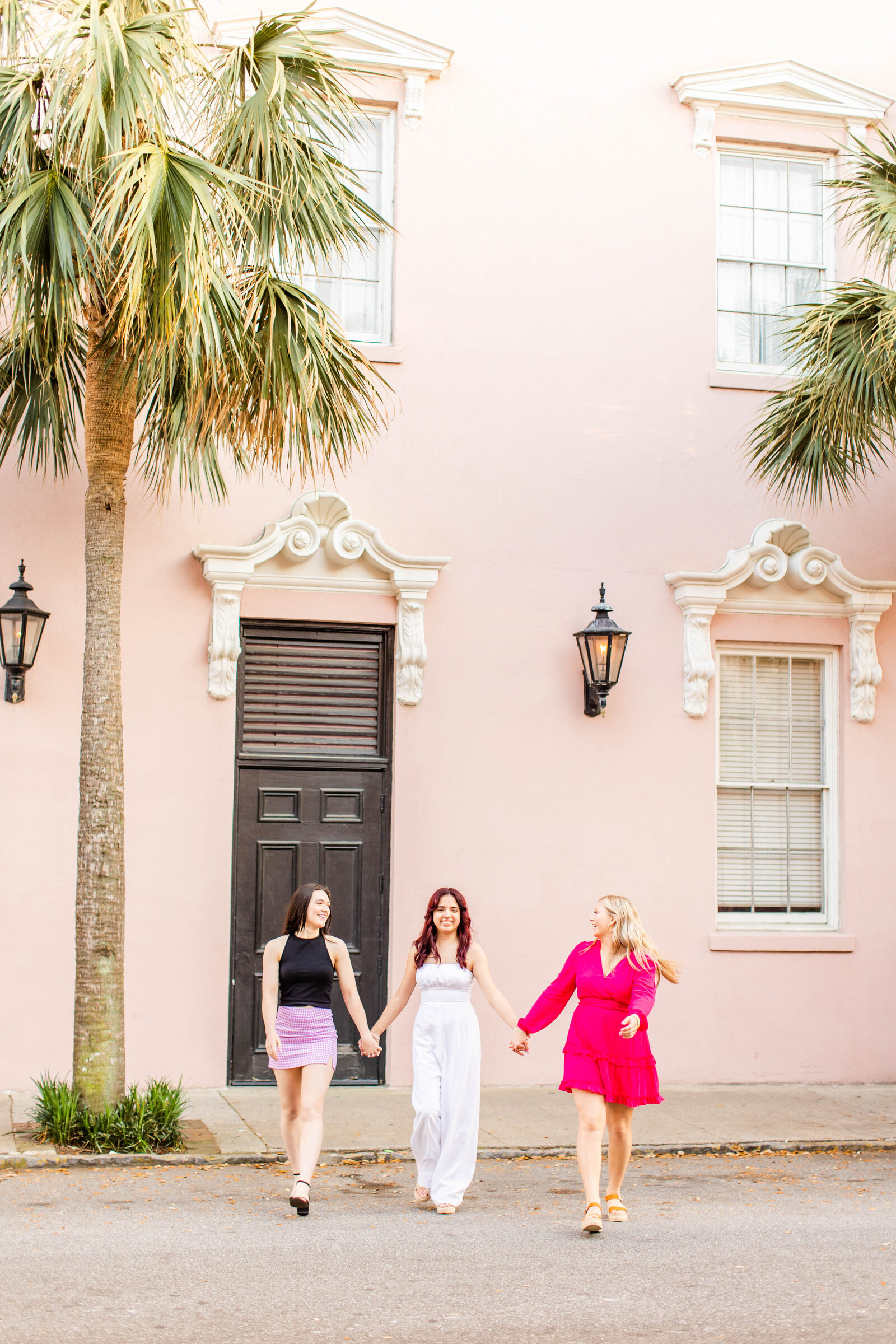 senior girls walking together at Mills Hotel in Charleston