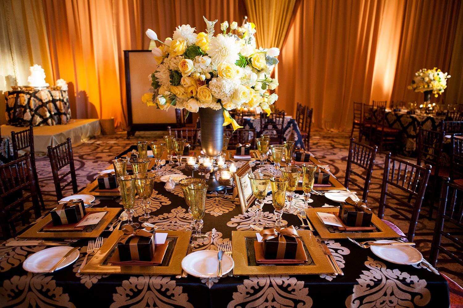 Ornate and richly colored table settings at a wedding reception