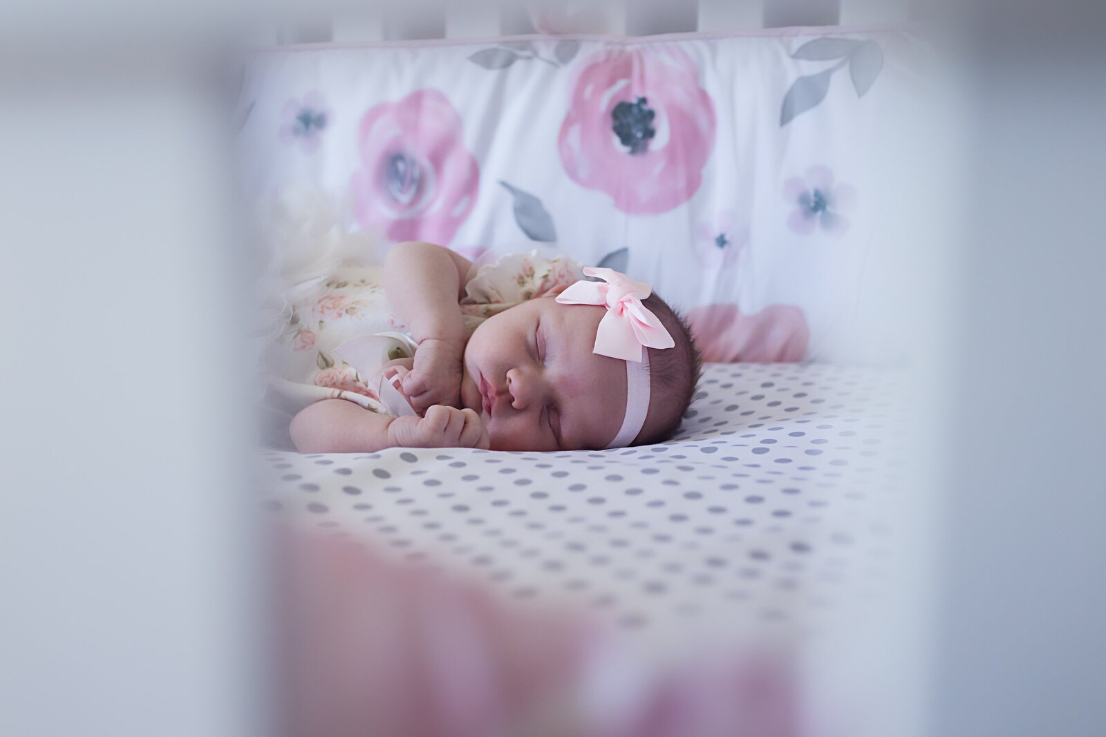Newborn girl in crib photo