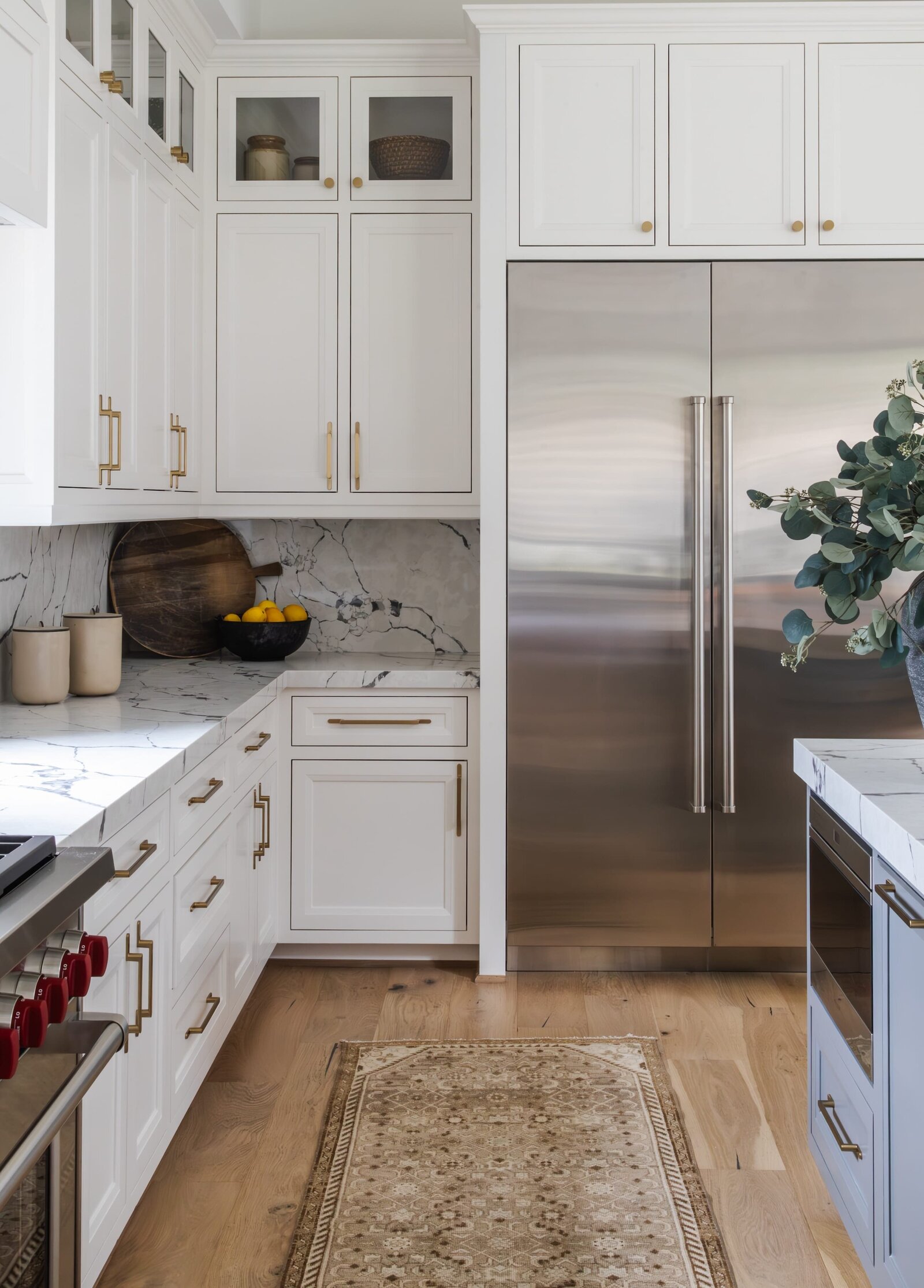 vision and hammer kitchen with accent rug and wooden floors