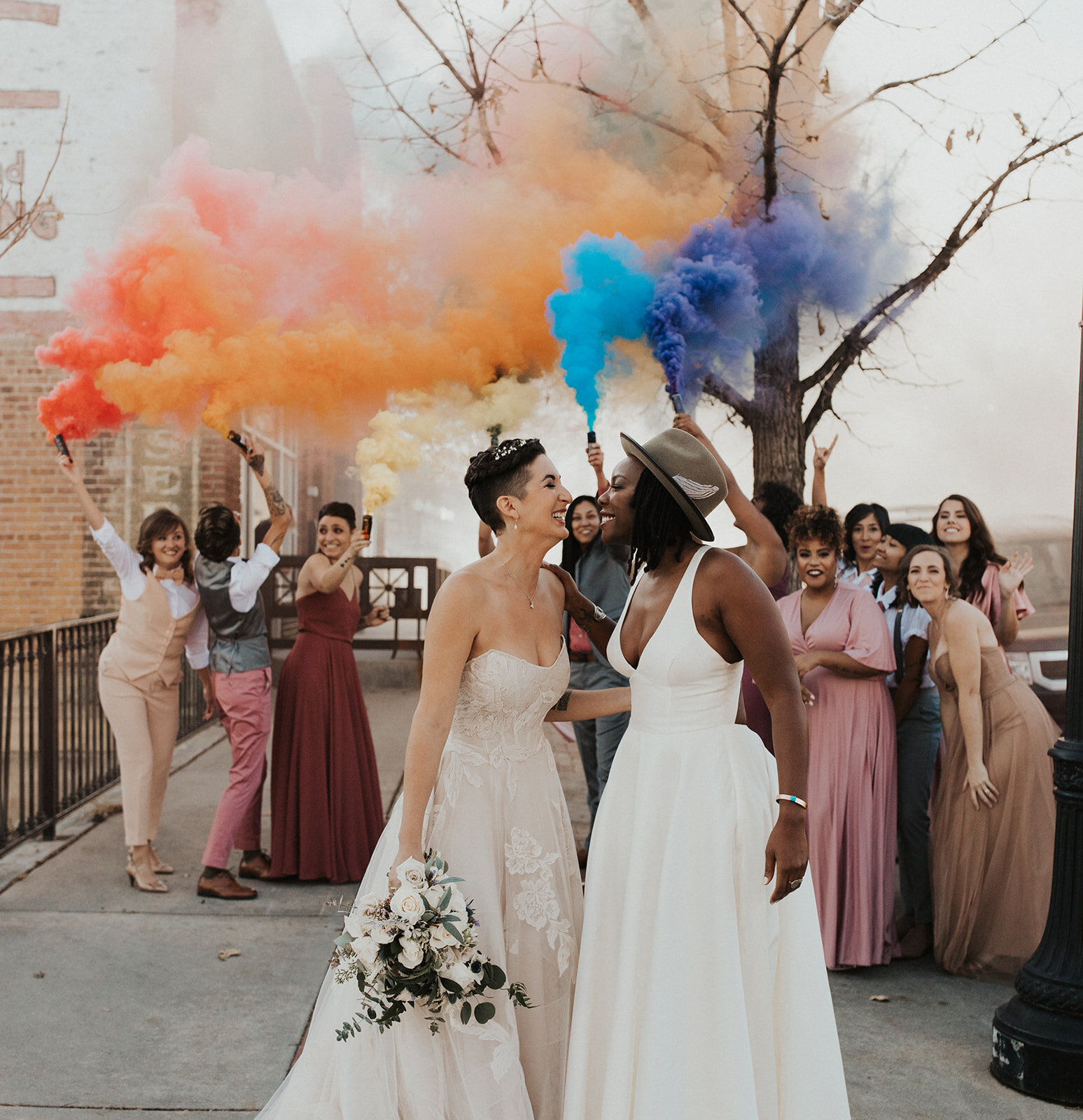 Rainbow smoke bombs for LGBTQ wedding exit at the st vrain, colorado