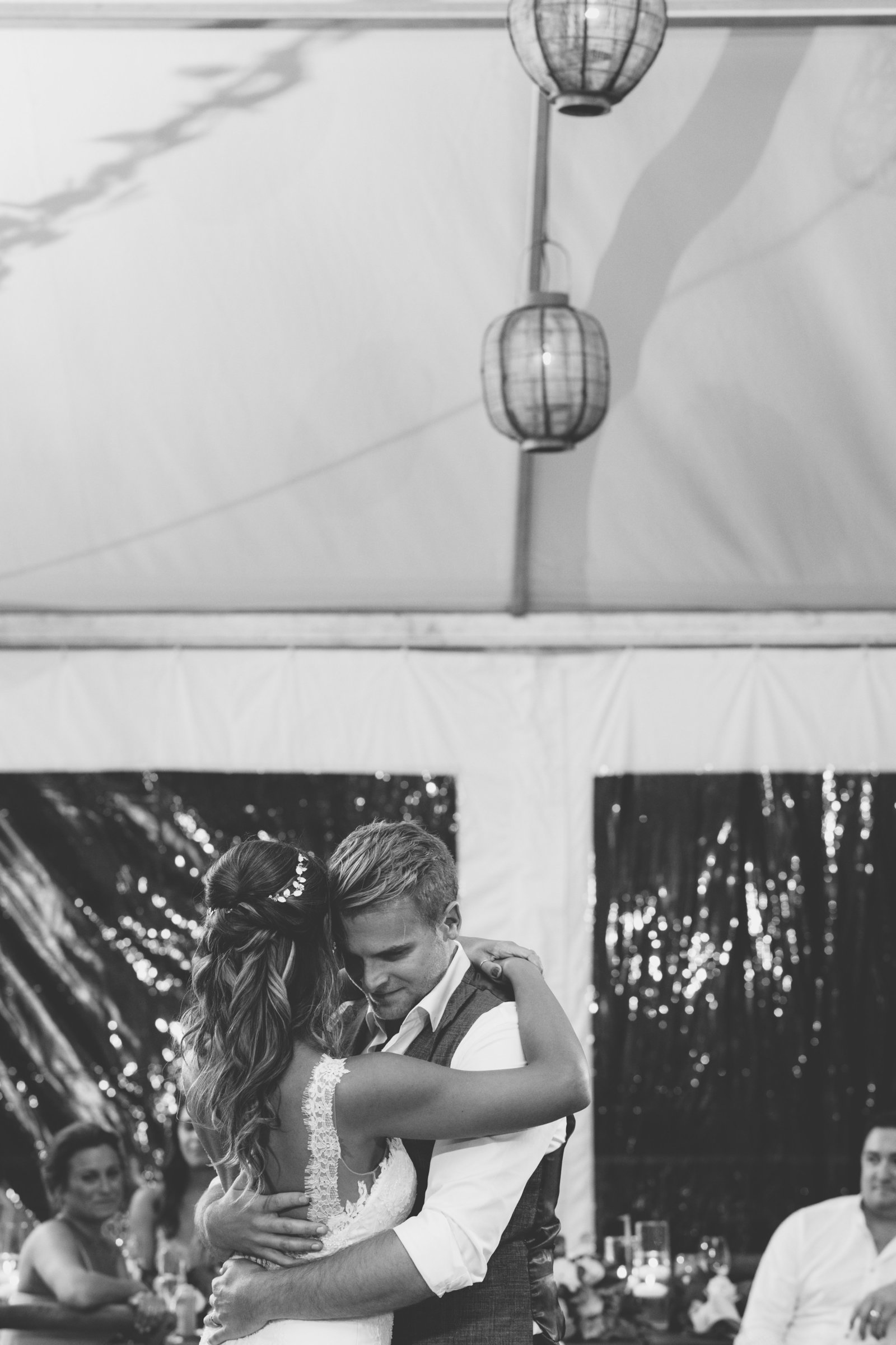 black and white photo of bride groom hugging and dancing Gurneys Montauk Resort wedding