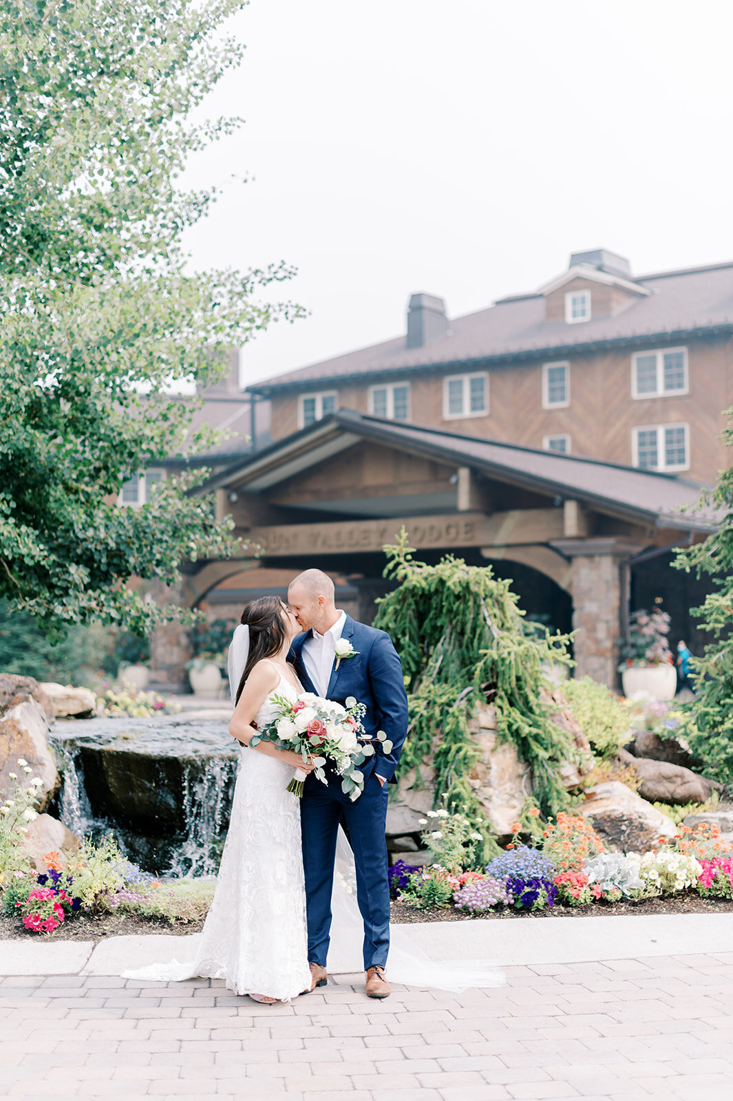 Bride and groom posing in front of Sun Valley Resort at Trail Creek Cabin Wedding taken by the Best Sun Valley Wedding Photographers