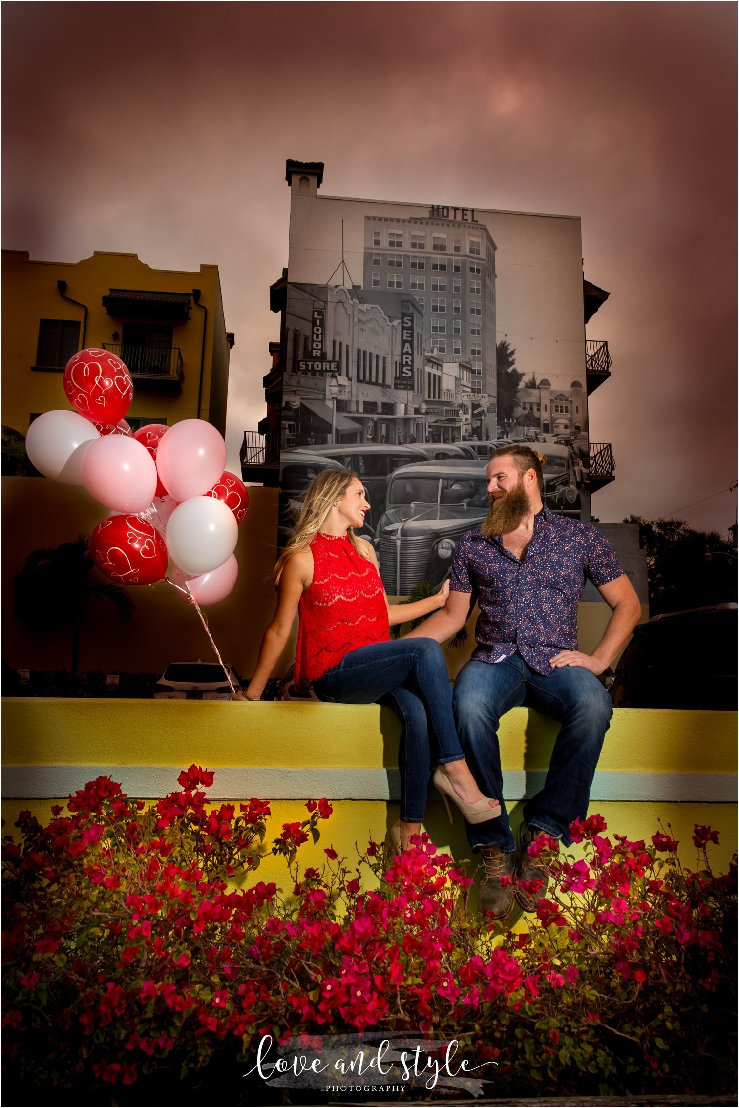 Sarasota Engagement Photography of couple with  red and pink balloons downtown Sarasota