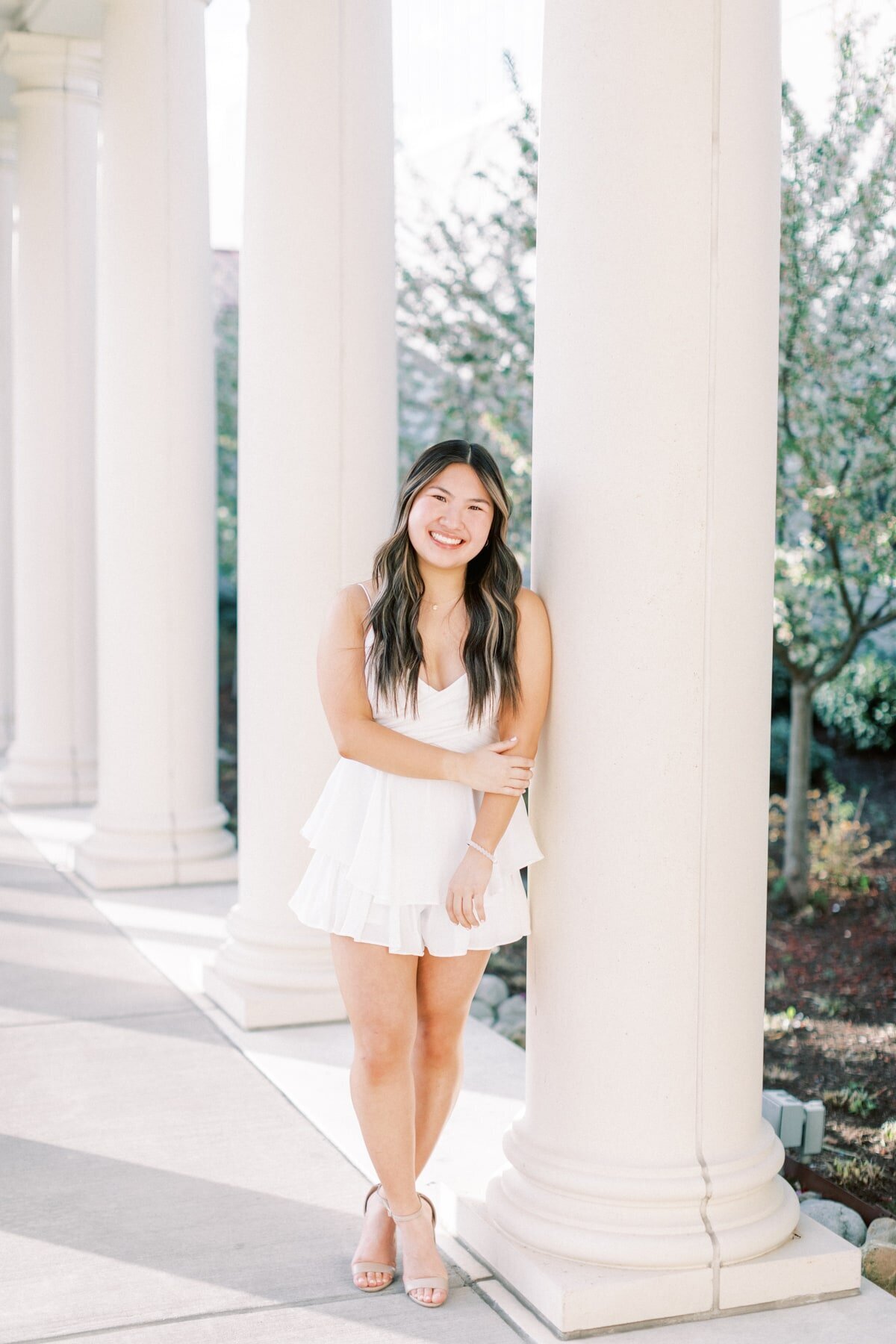 An asian girl gets her photos taken at James Madison University