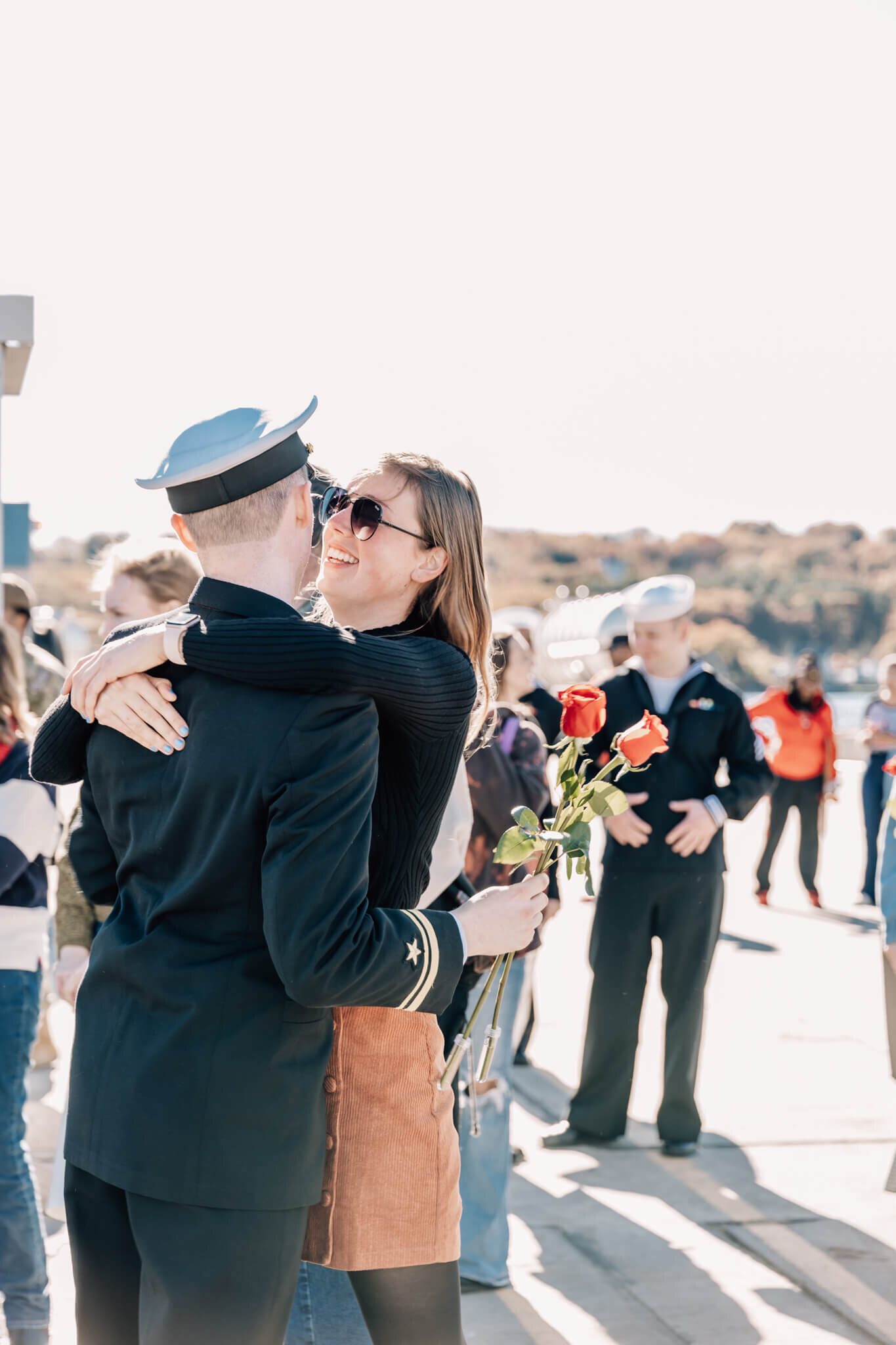 Naval officer embraces partner at USS North Dakota military homecoming at Naval Submarine Base New London in Groton, CT.