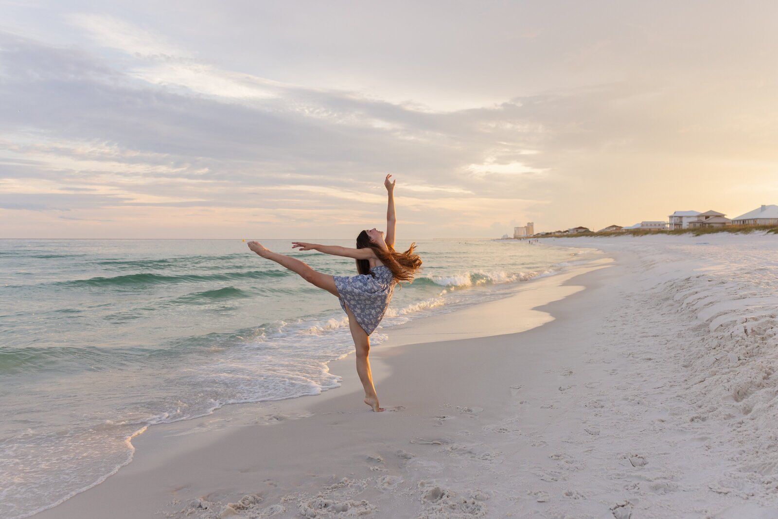 Ballerina striking a pose during Senior Beach Portraits on Pensacola Beach.