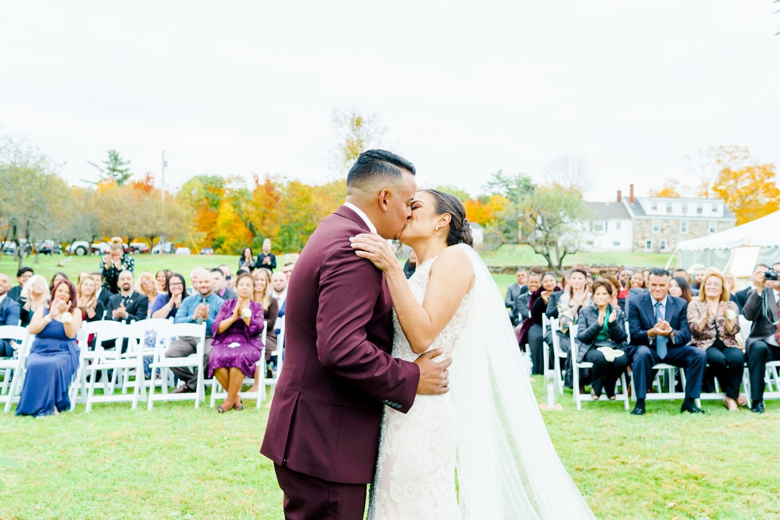Bride and groom kissing at New Hampshire wedding ceremony