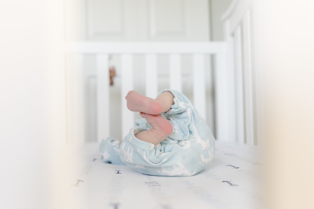 newborn-feet-in-white-crib-27
