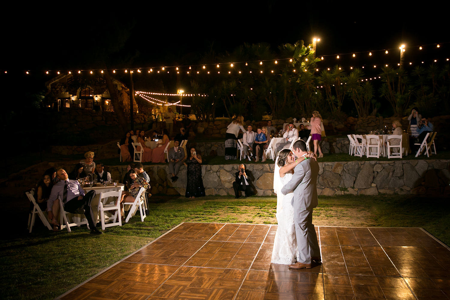 nightime reception image bride and groom dancing