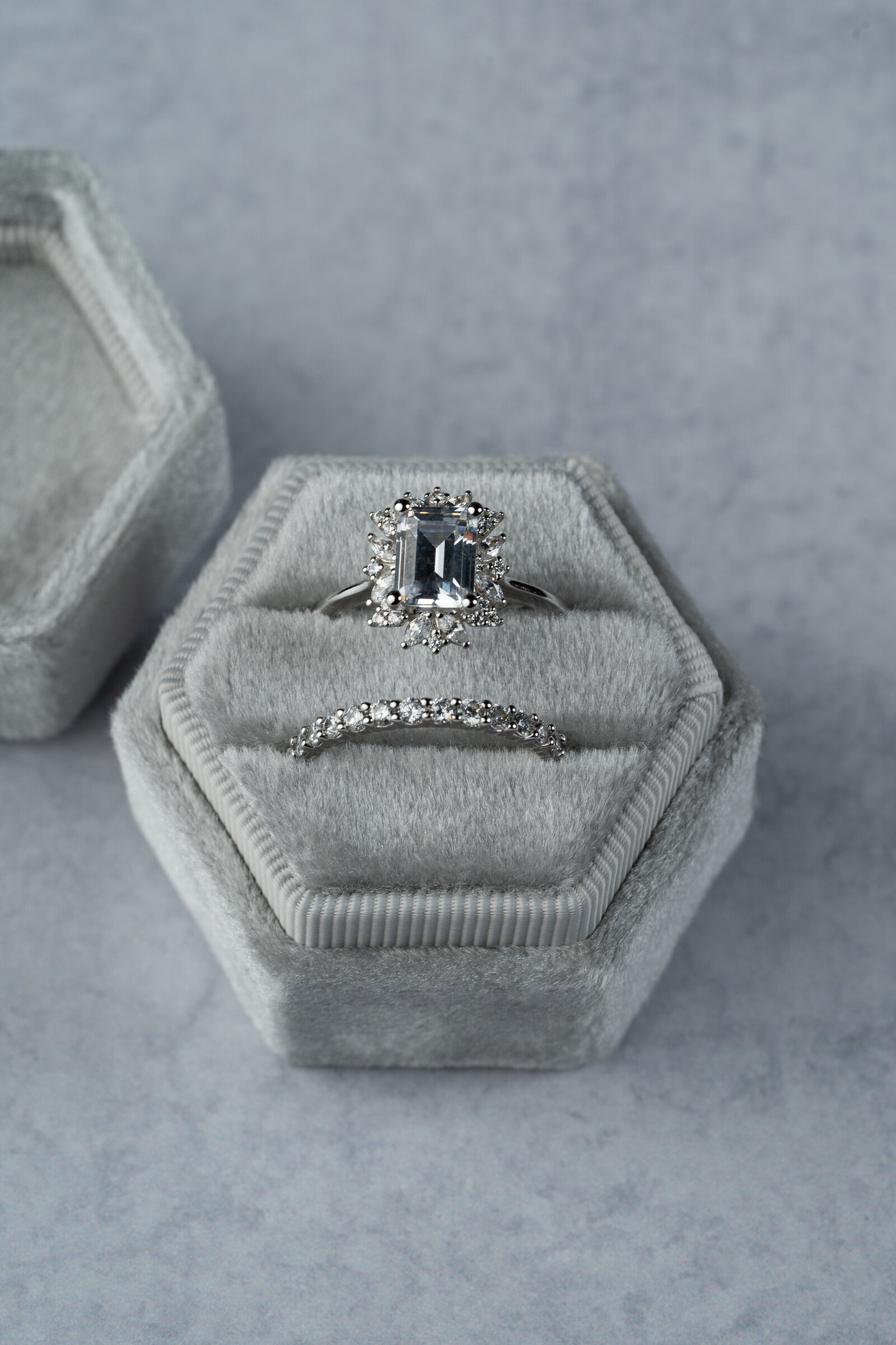 a stunning set of wedding rings in white gold with a gray velvet box