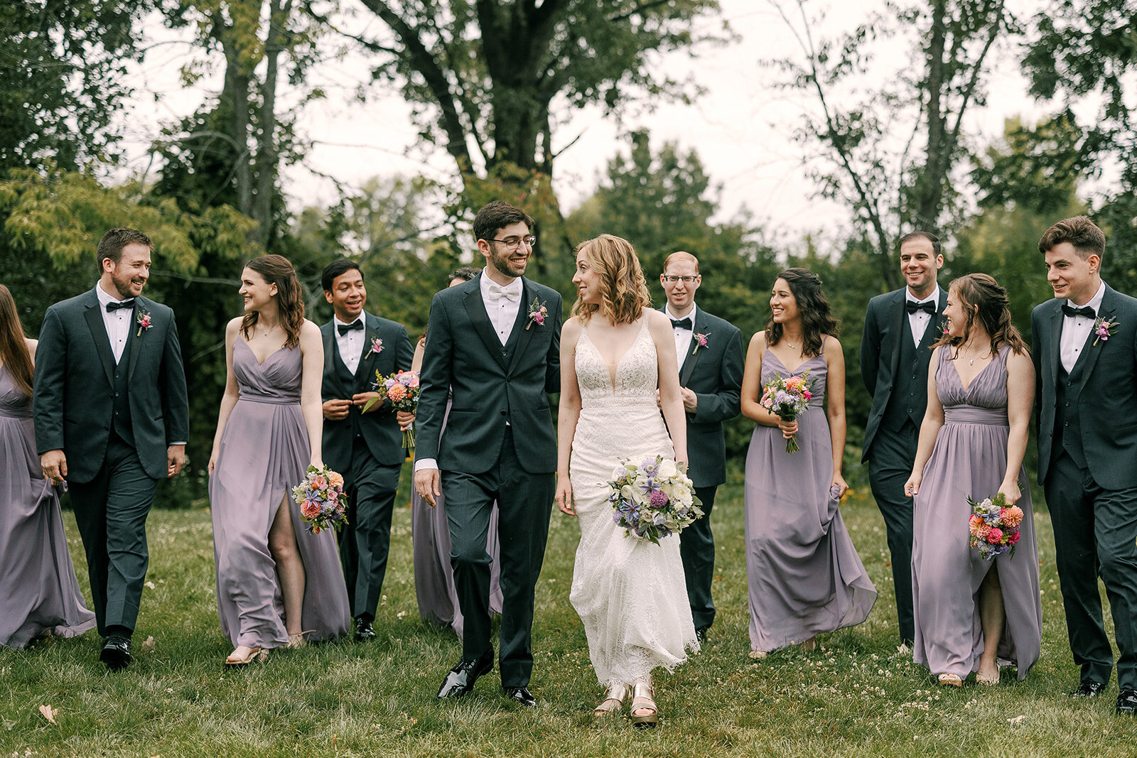 bride and groom with their bridal parties at barnwood events in madison, winconsin.