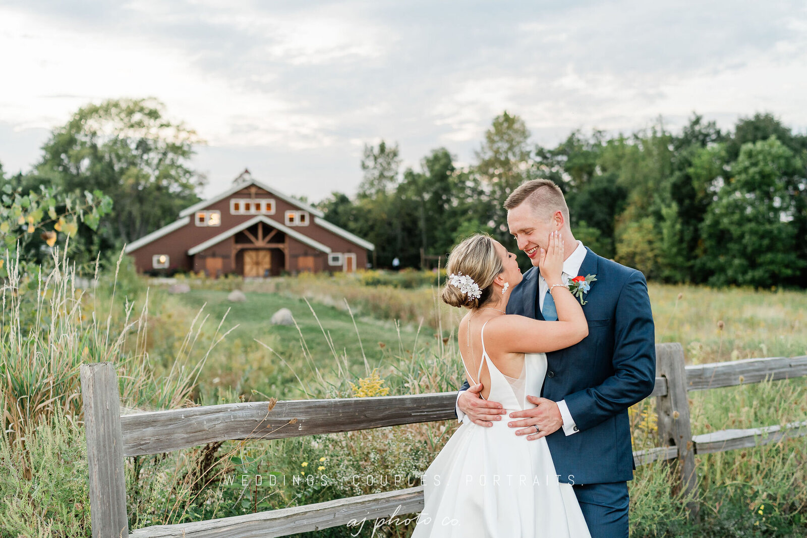 bride and groom doing sweet gesture outside the fence.