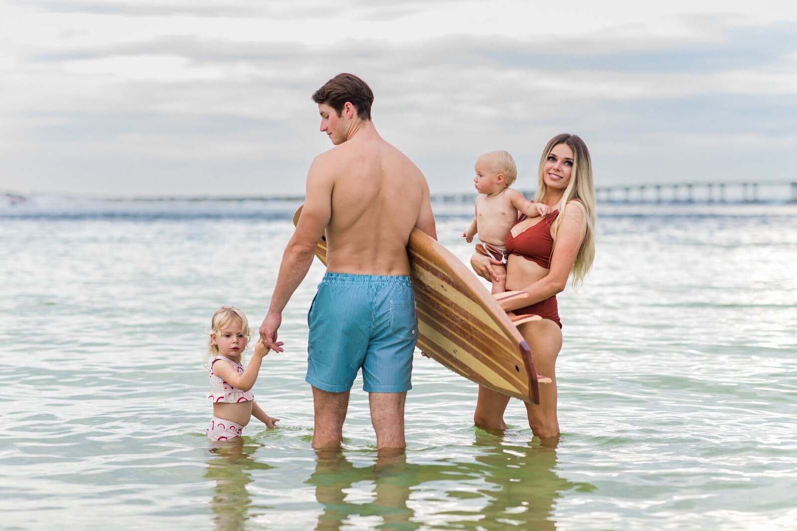 Destin  vacation family photo session . Family playing in the water.